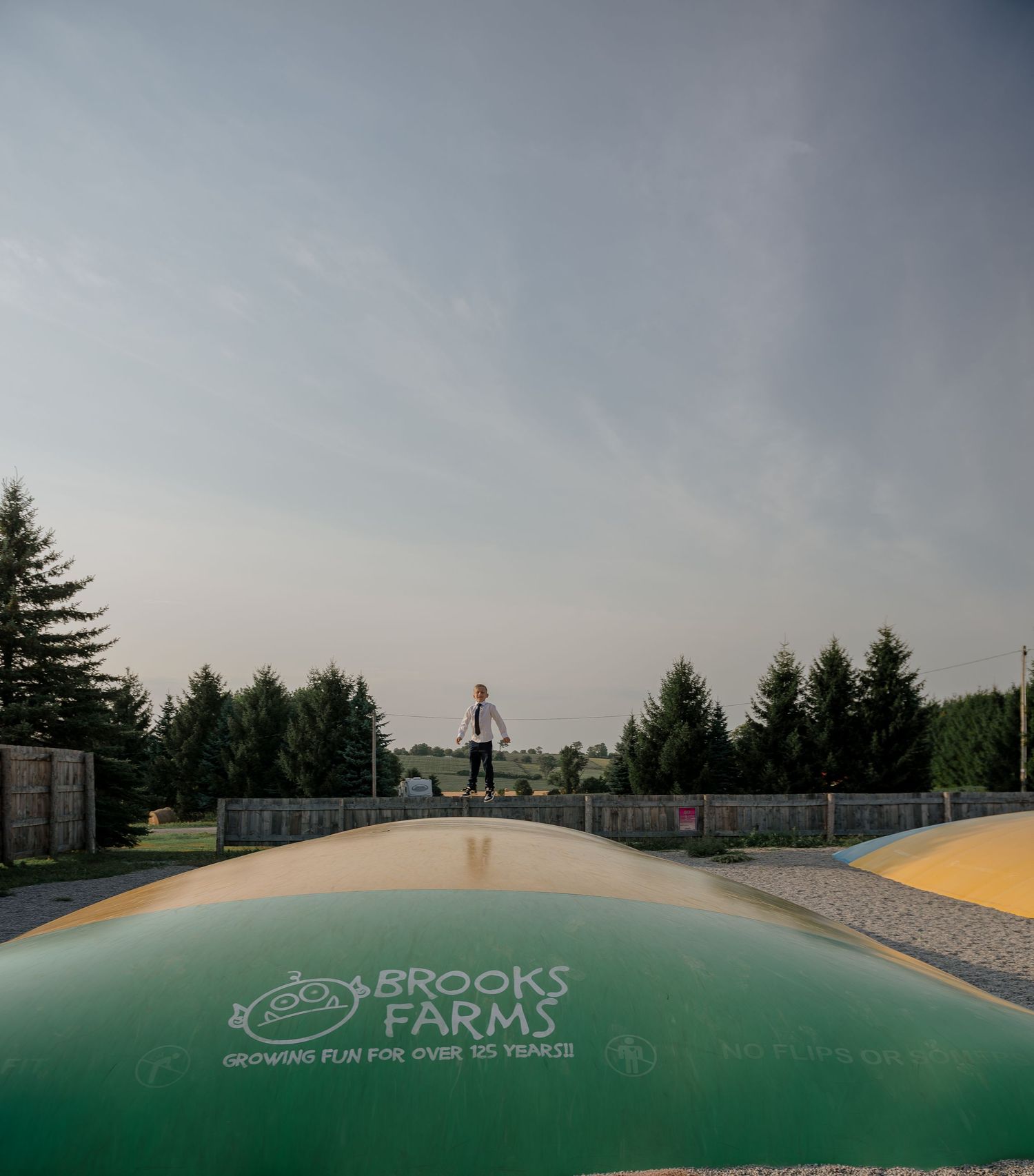 Panoramic view of Brooks Farm wedding venue with curved architecture.