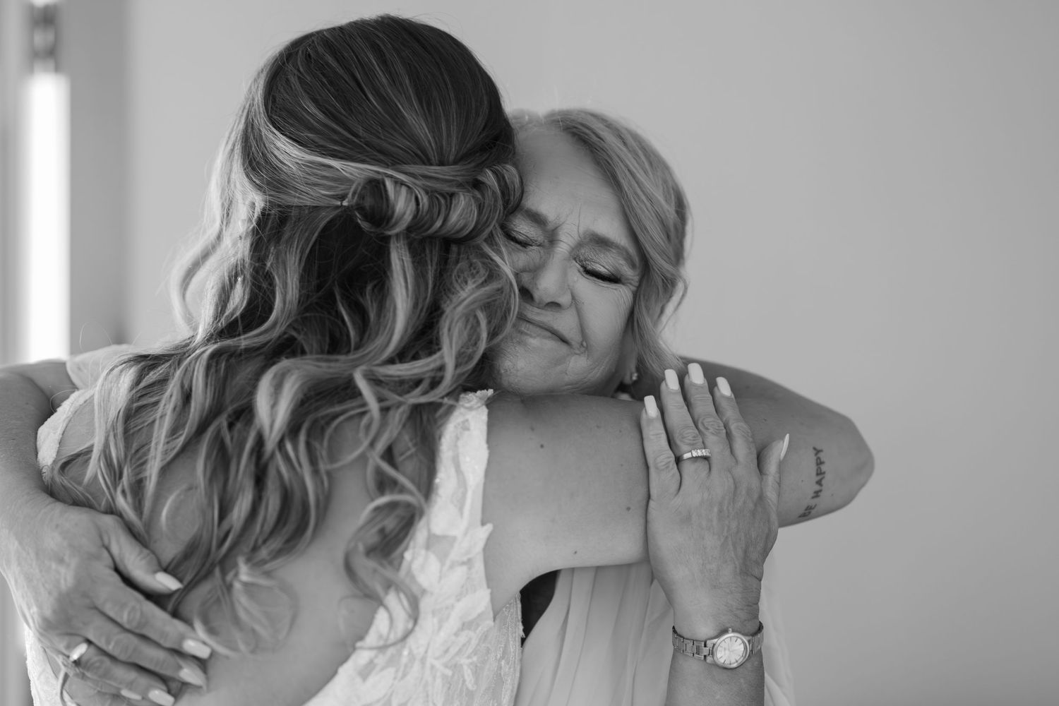 A series of romantic black and white wedding photos showing intimate moments between a couple.
