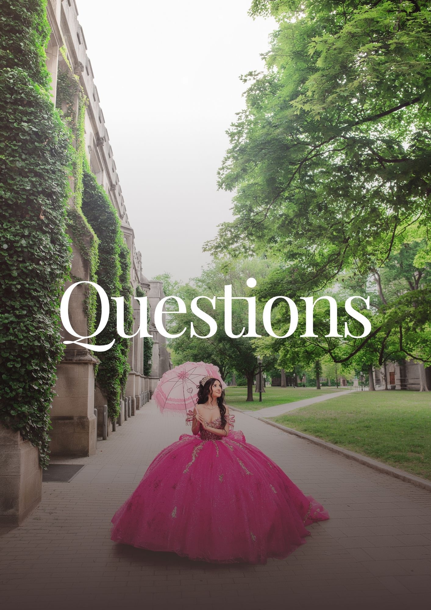 Young woman in a pink ball gown holding a parasol on a tree-lined path beside an ivy-covered building.