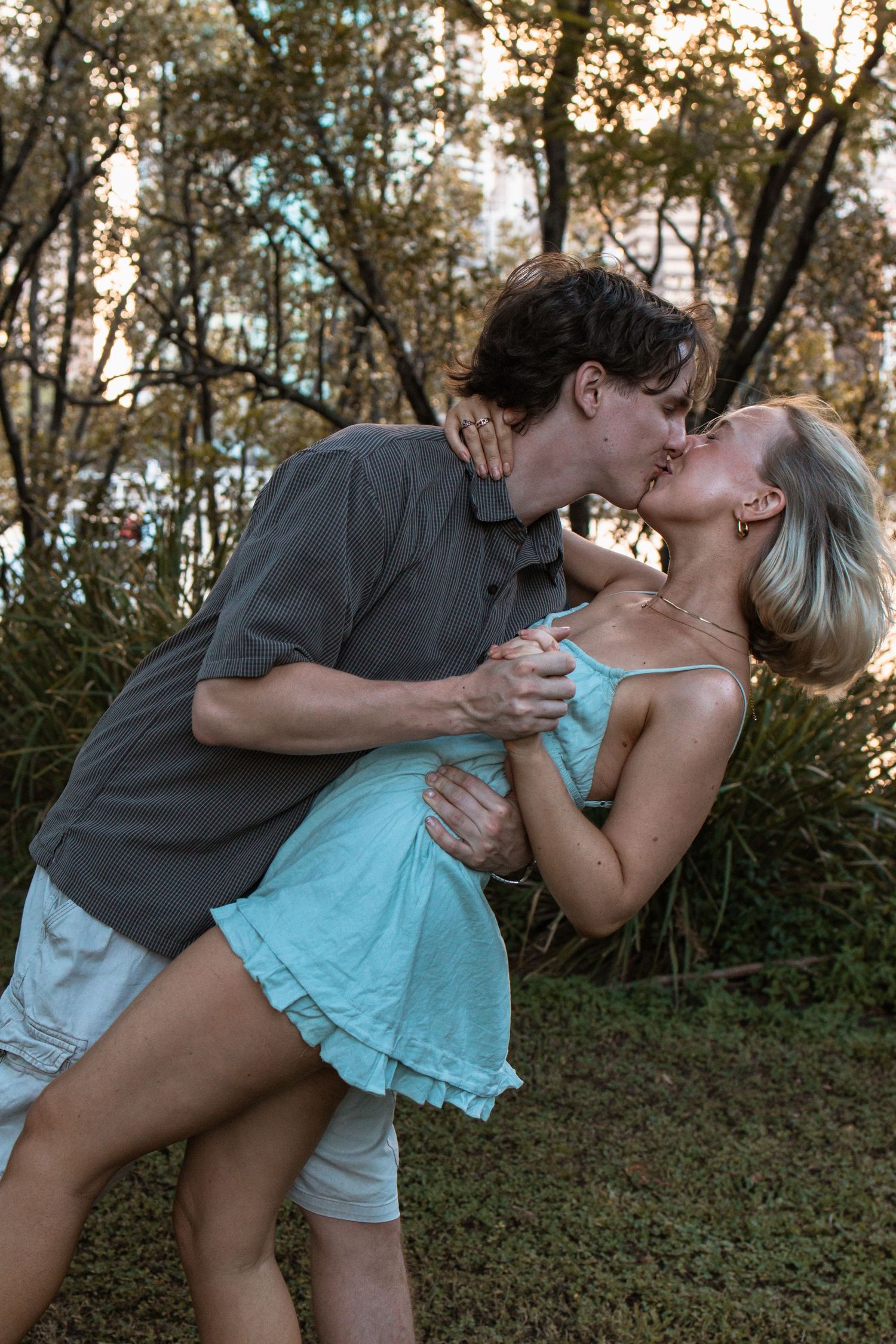 couple kissing as the woman is dipped by the man