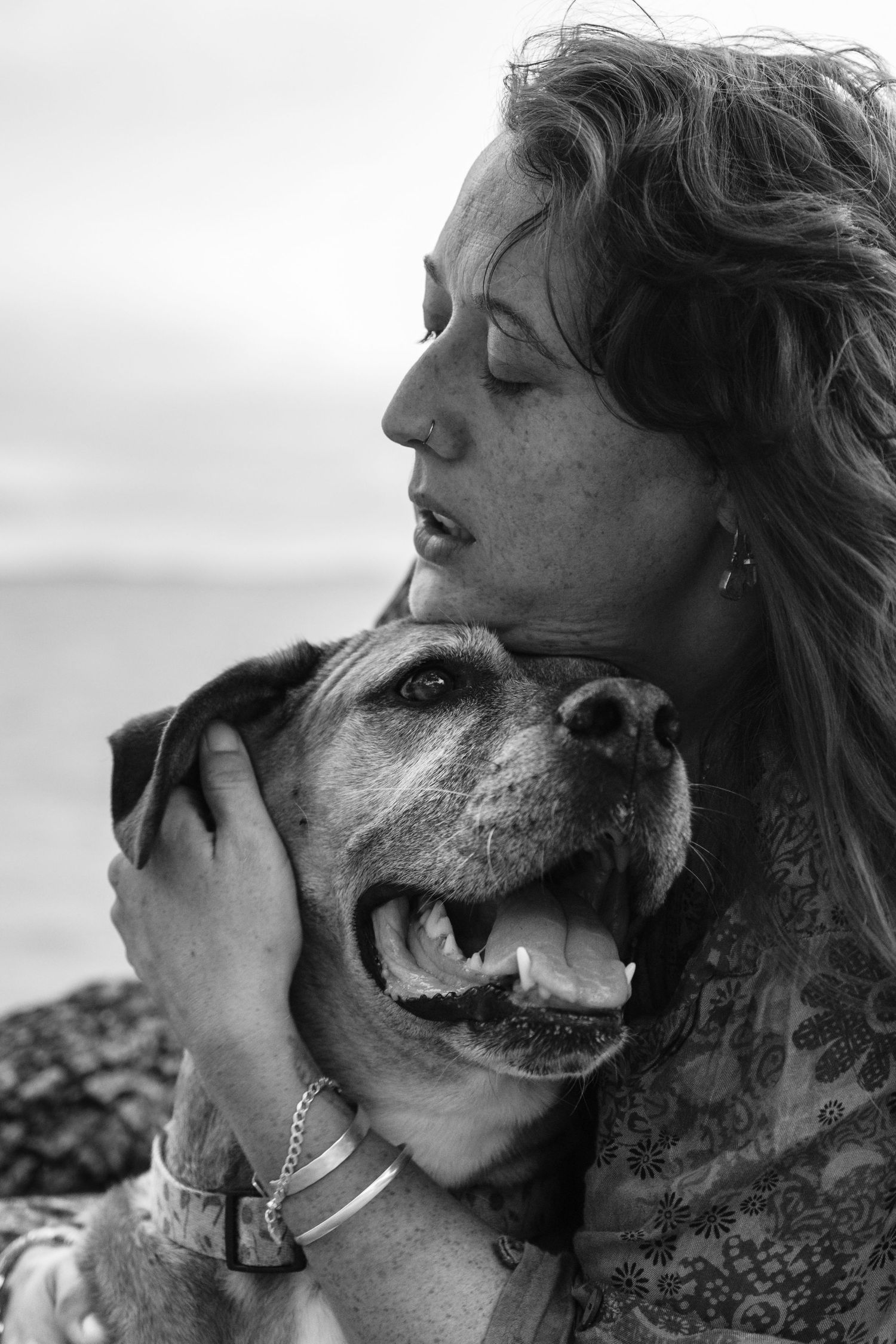 black and white photo of a woman with her dog