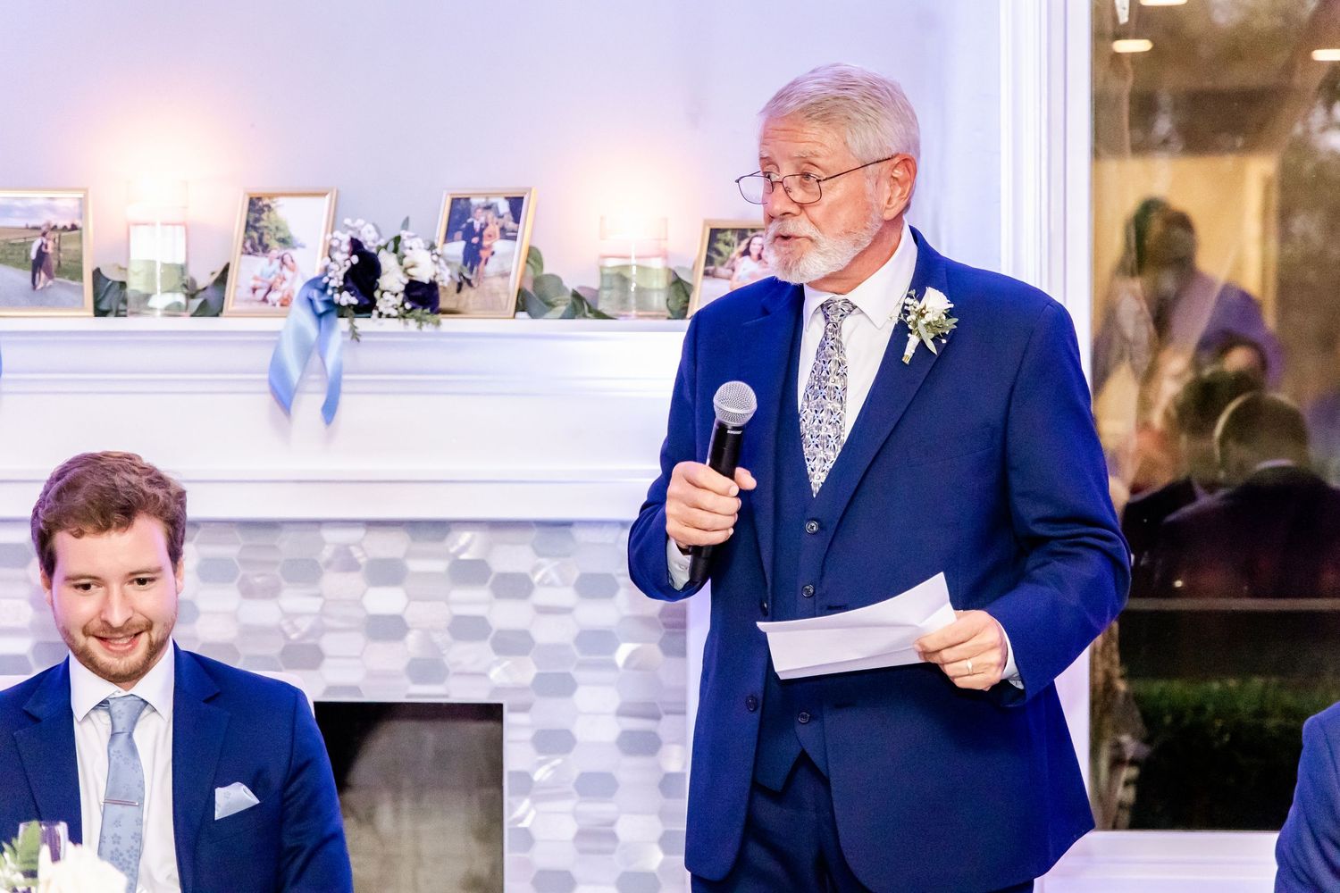 A sequence of candid moments during wedding speeches and toasts at an indoor reception.
