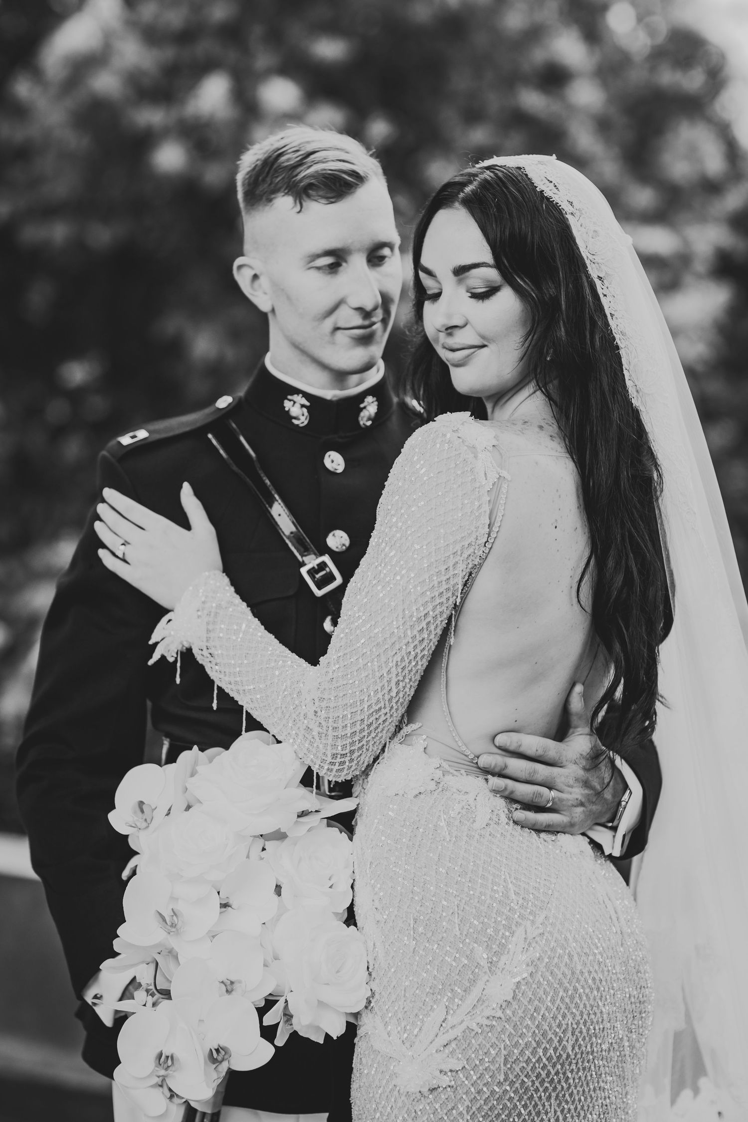 Intimate black and white wedding portraits showing tender moments between newlyweds.