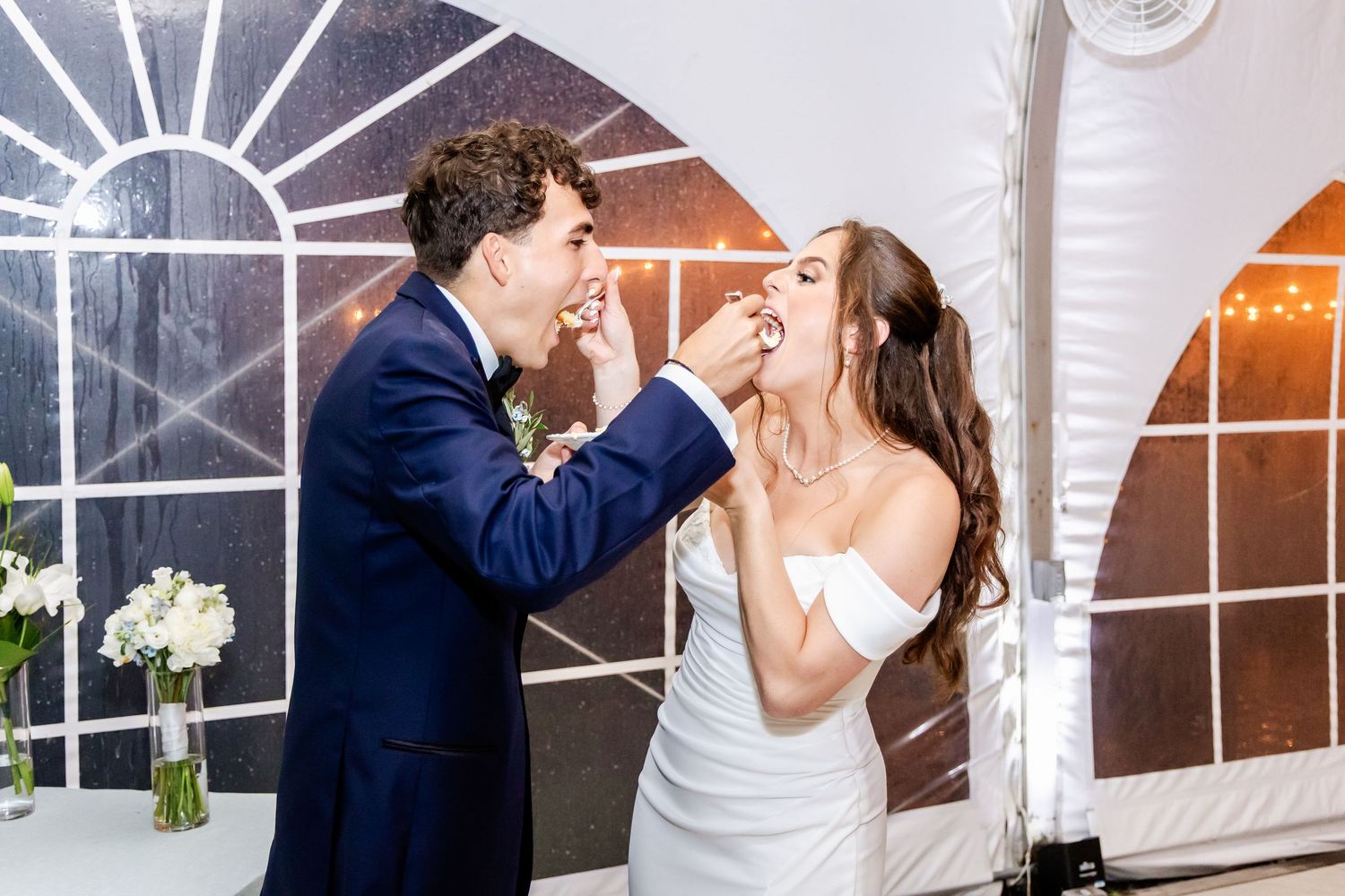 Indoor wedding reception moments with romantic lighting and decor.