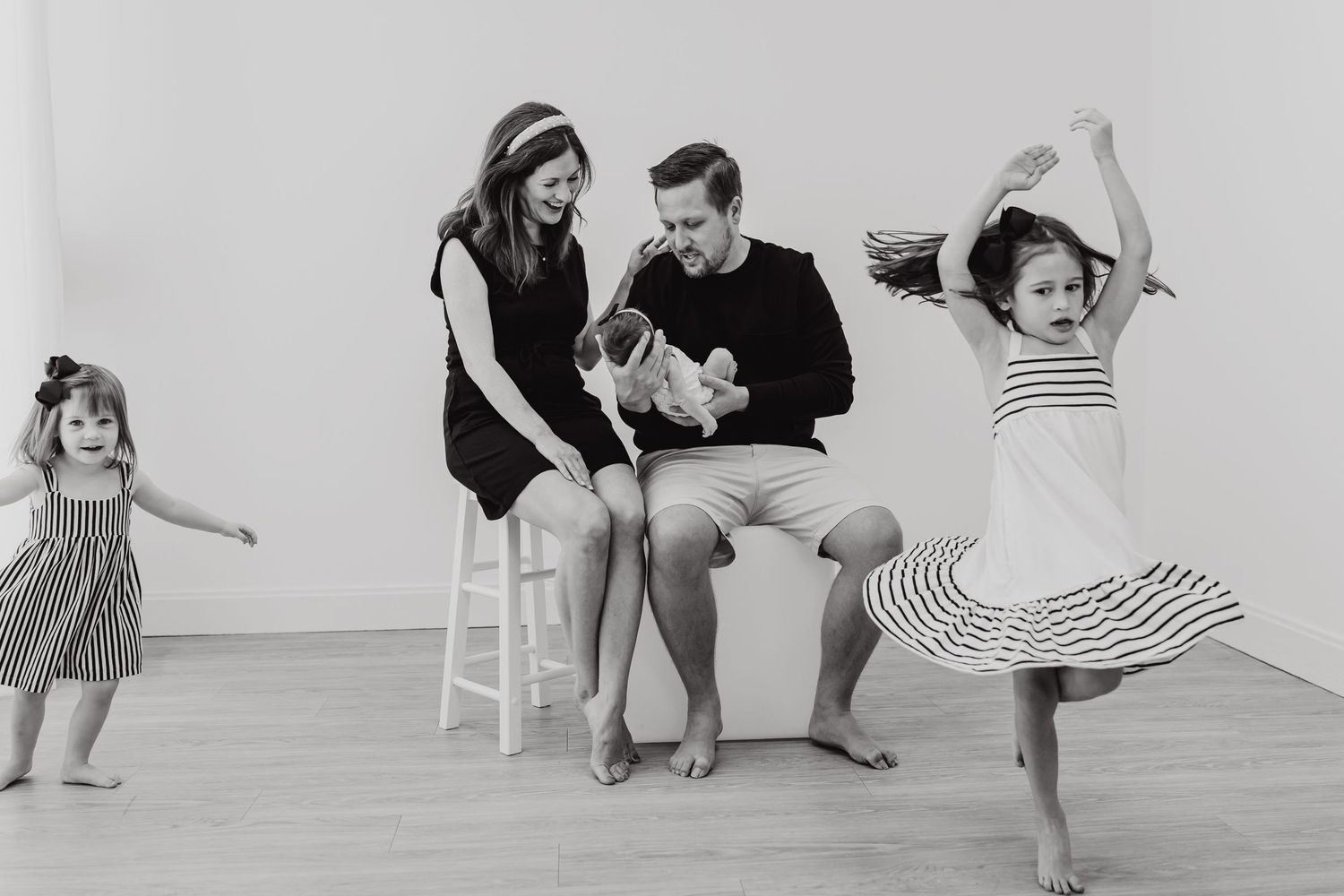 A series of black and white dance photos showing graceful movement and partner interactions in a studio setting.