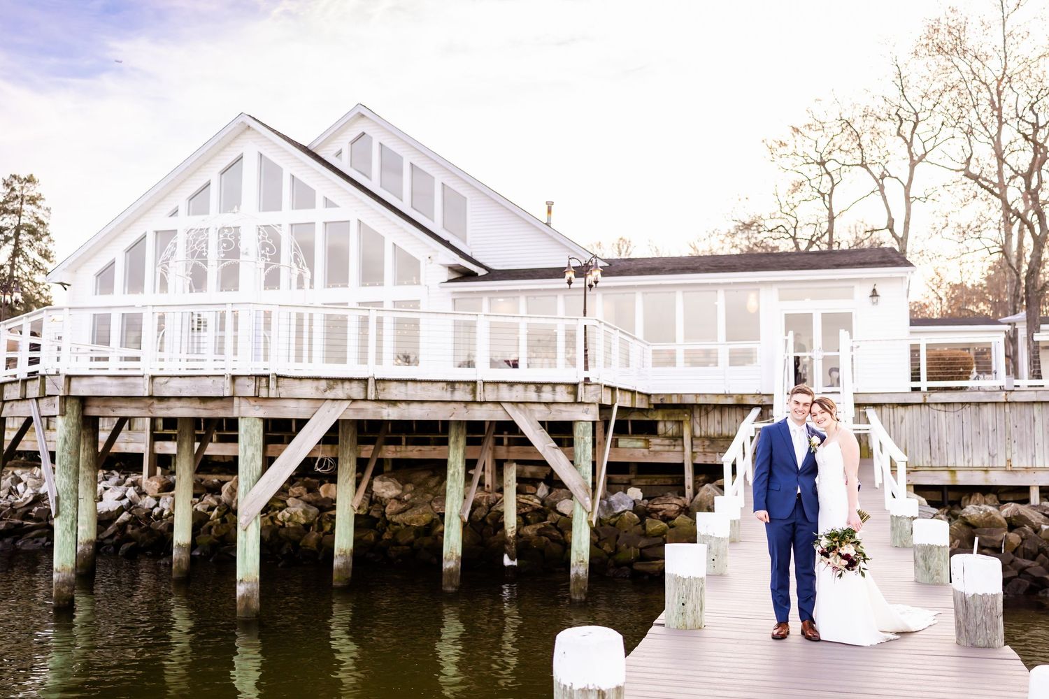 A series of wedding venue exterior shots showing a white building and covered walkway at different angles.