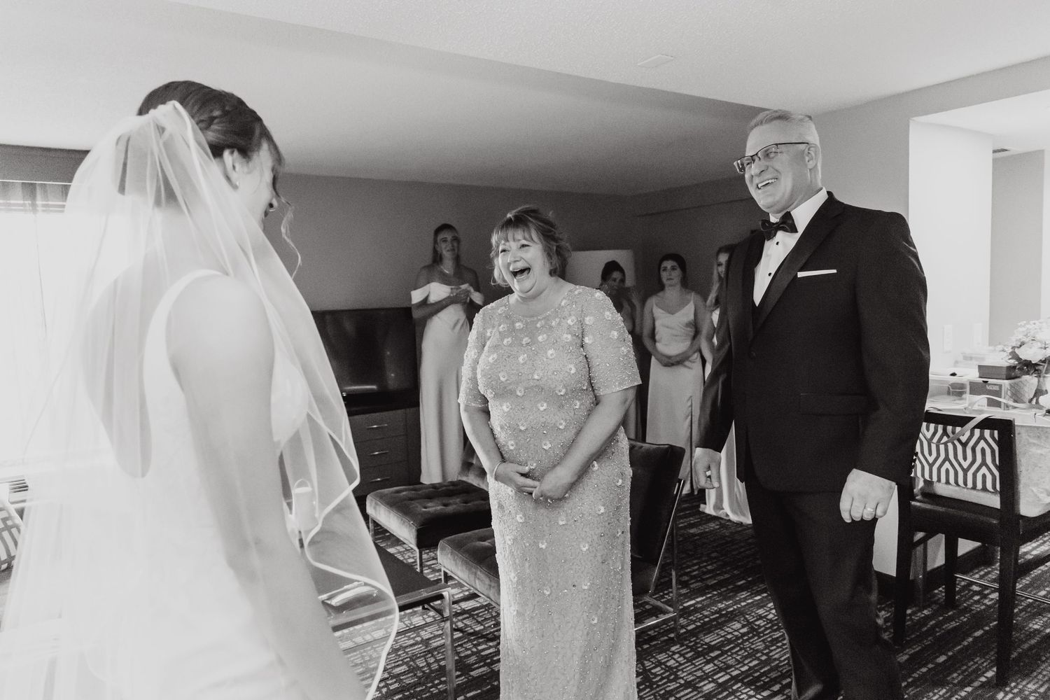 A black and white wedding photo collage showing intimate moments of preparation and celebration.