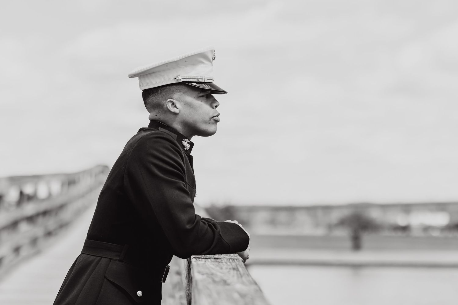 Black and white portrait of service member in military uniform.