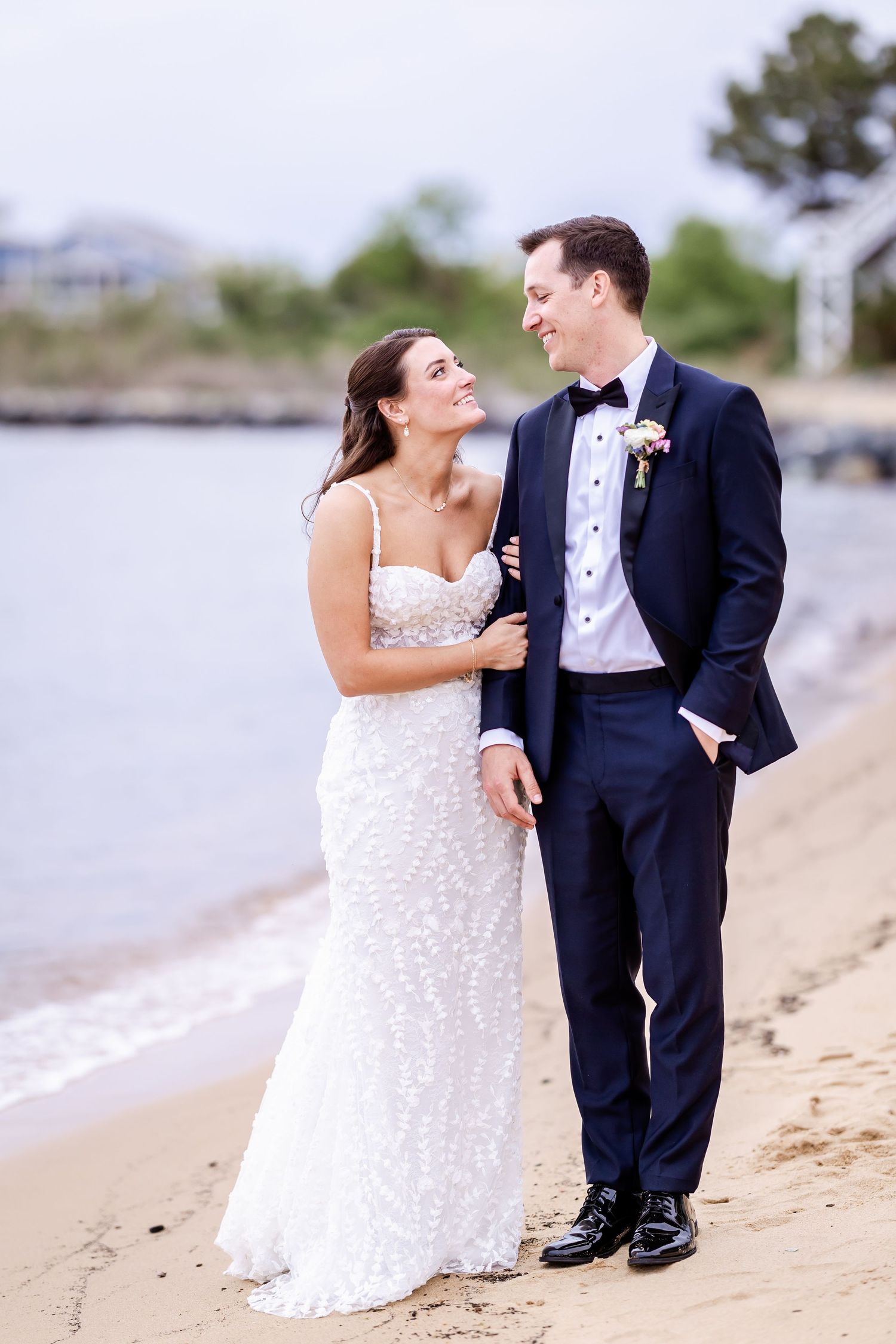 Couple sharing intimate moments during their beach wedding photoshoot.
