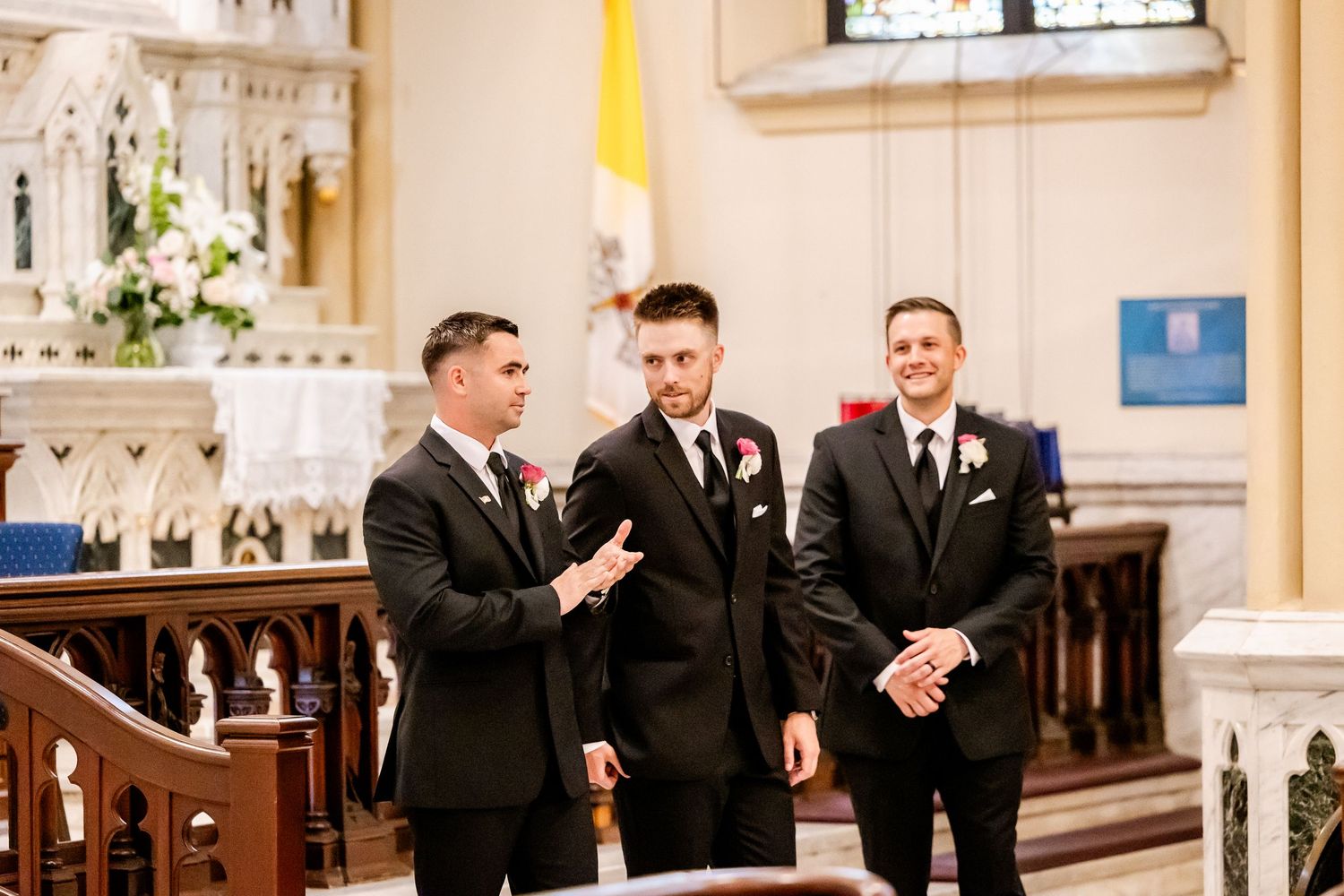 Church interior with guests in formal attire during a ceremony.