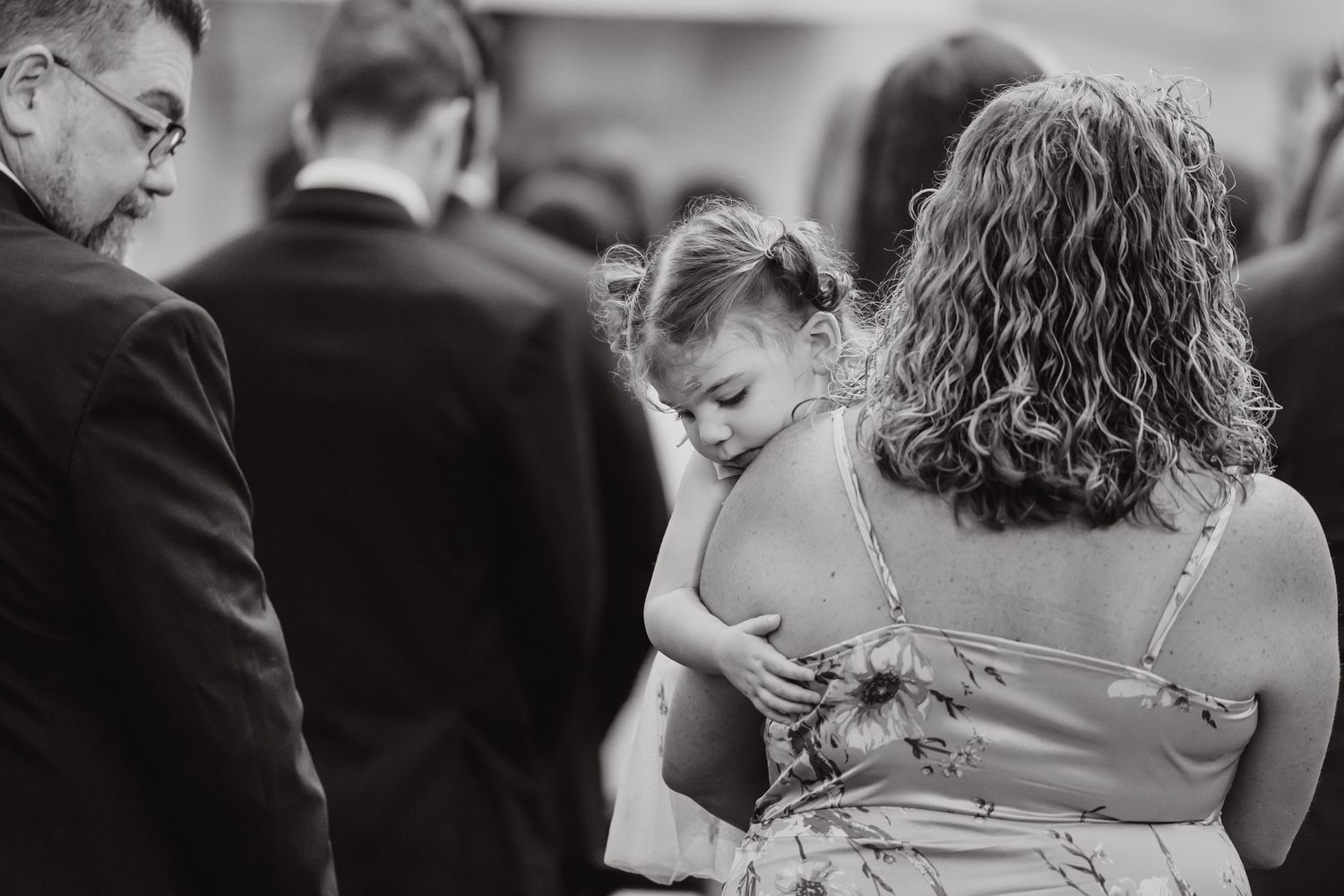 Intimate black and white photographs capturing tender moments during the wedding ceremony.