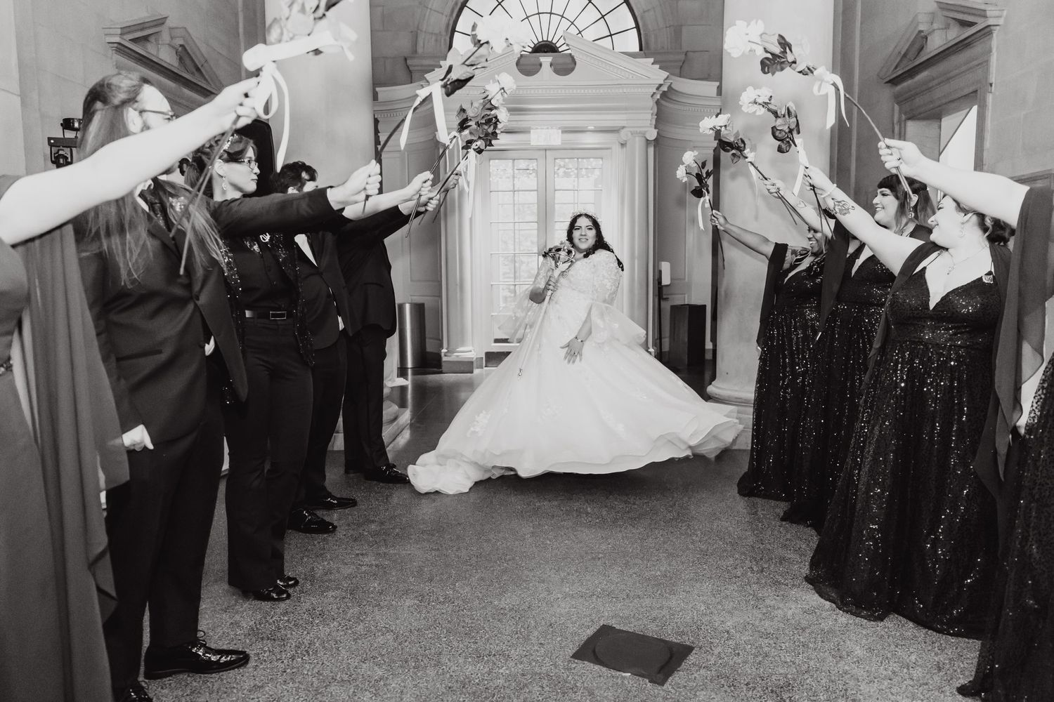 Black and white photo of wedding exit with sparklers in classic vintage style.