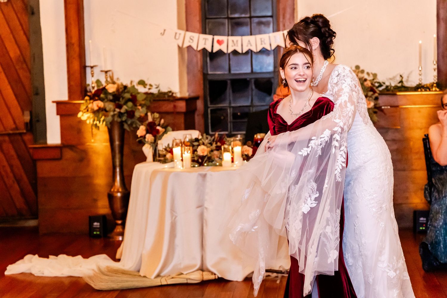 Wedding reception venue decorated with floral arrangements and soft lighting.