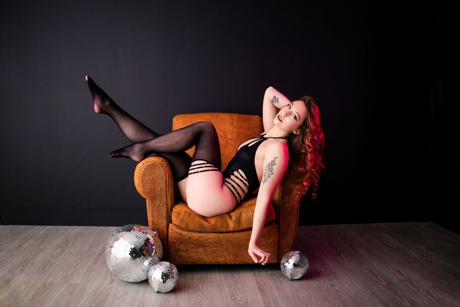 A dark and moody artistic portrait series featuring a brown leather sofa against a black background.
