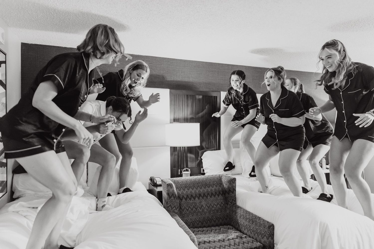A black and white photo sequence showing someone falling backwards onto a couch in six progressive stages.