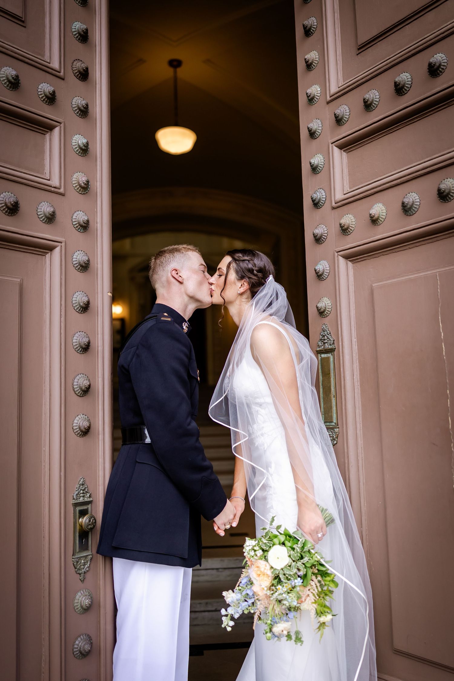 A sequence of intimate wedding moments captured in front of ornate wooden doors.