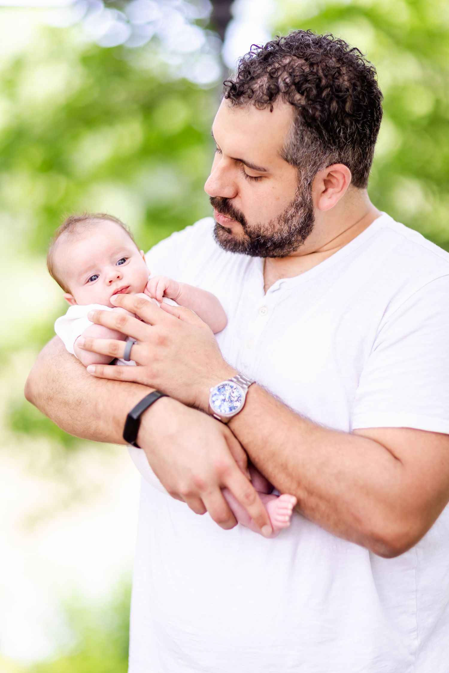 Sweet moment captured in bright natural lighting with soft bokeh background.