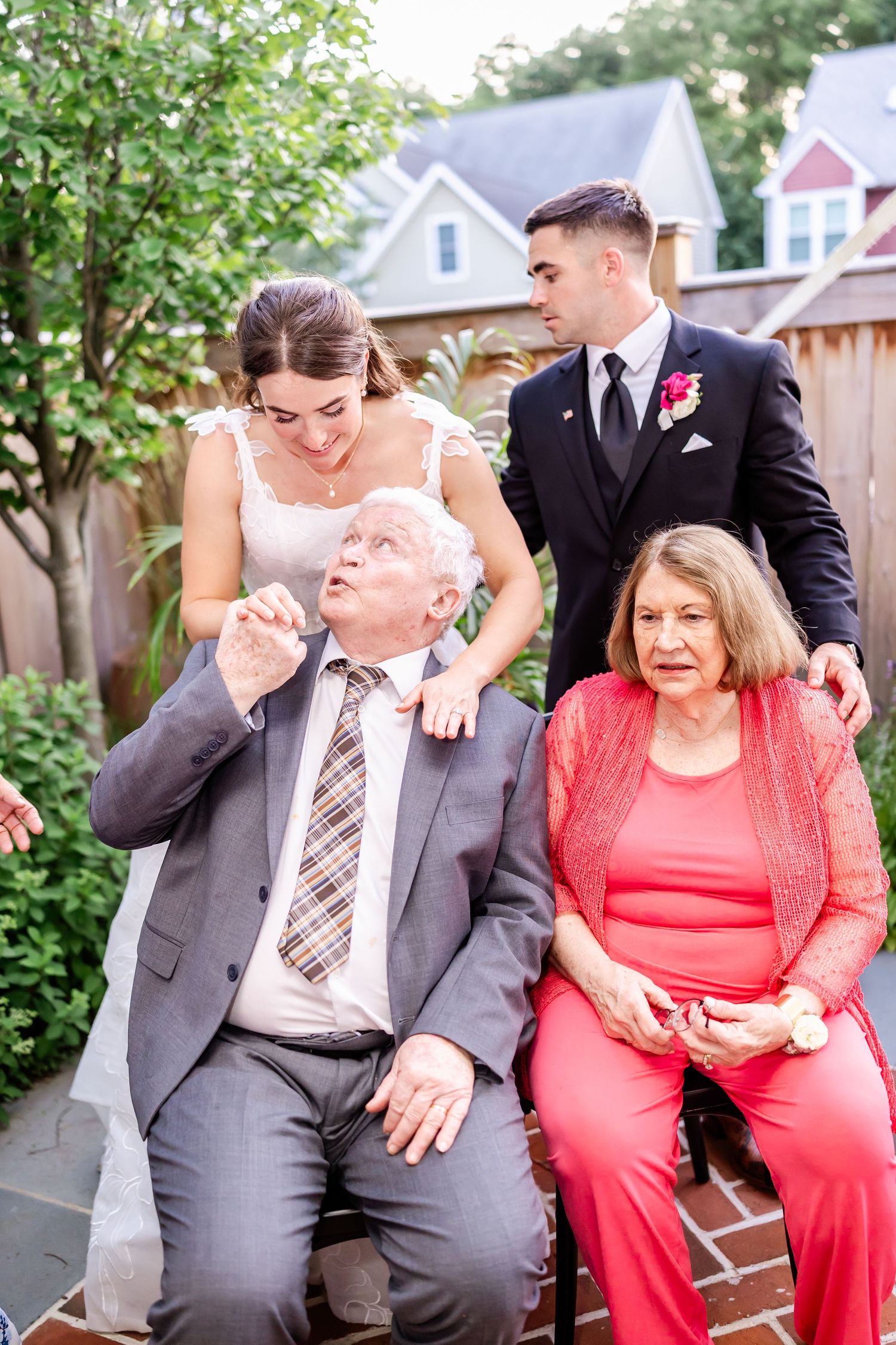 A series of candid moments showing a couple in formal wear sharing laughs while sitting on a bench in a garden setting.