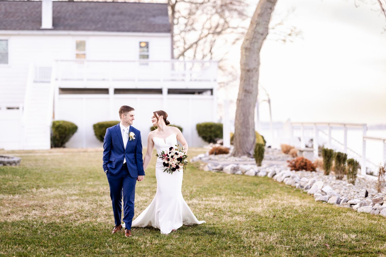 Bride and groom share intimate moment during outdoor wedding photo session.