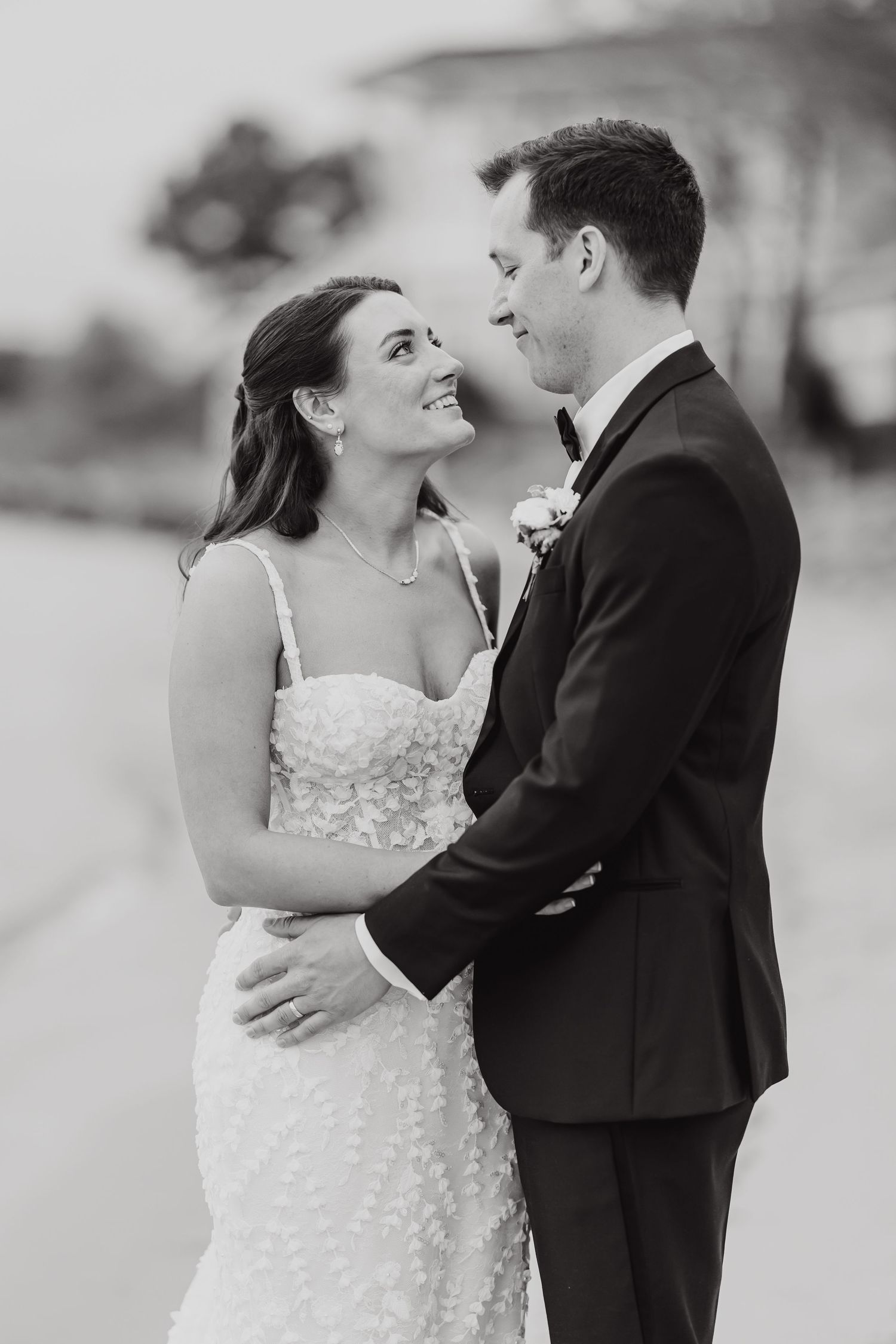 Black and white wedding photos capturing intimate moments between newlyweds on their special day.