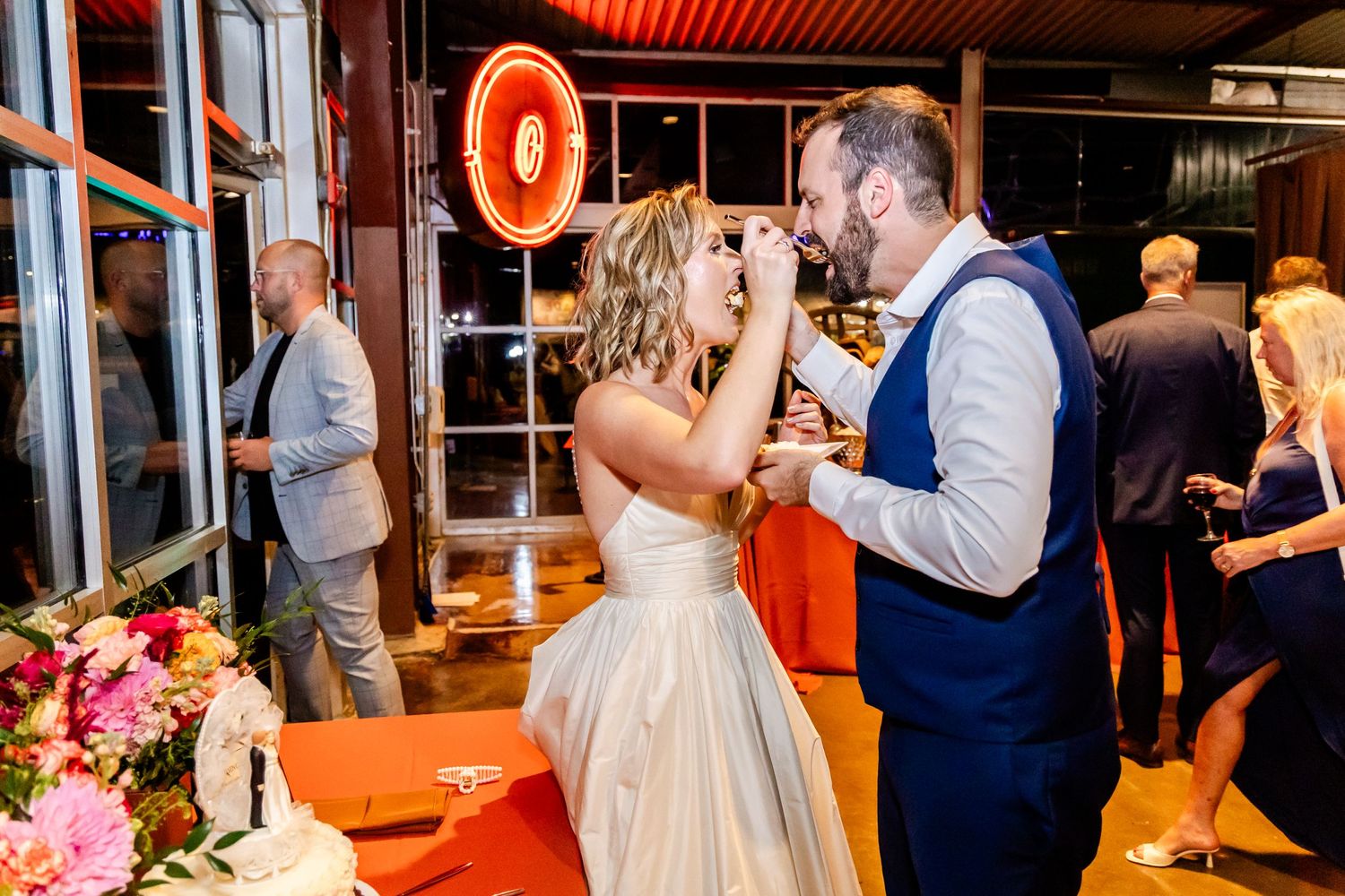 Couple sharing a celebratory drink together during their wedding reception.