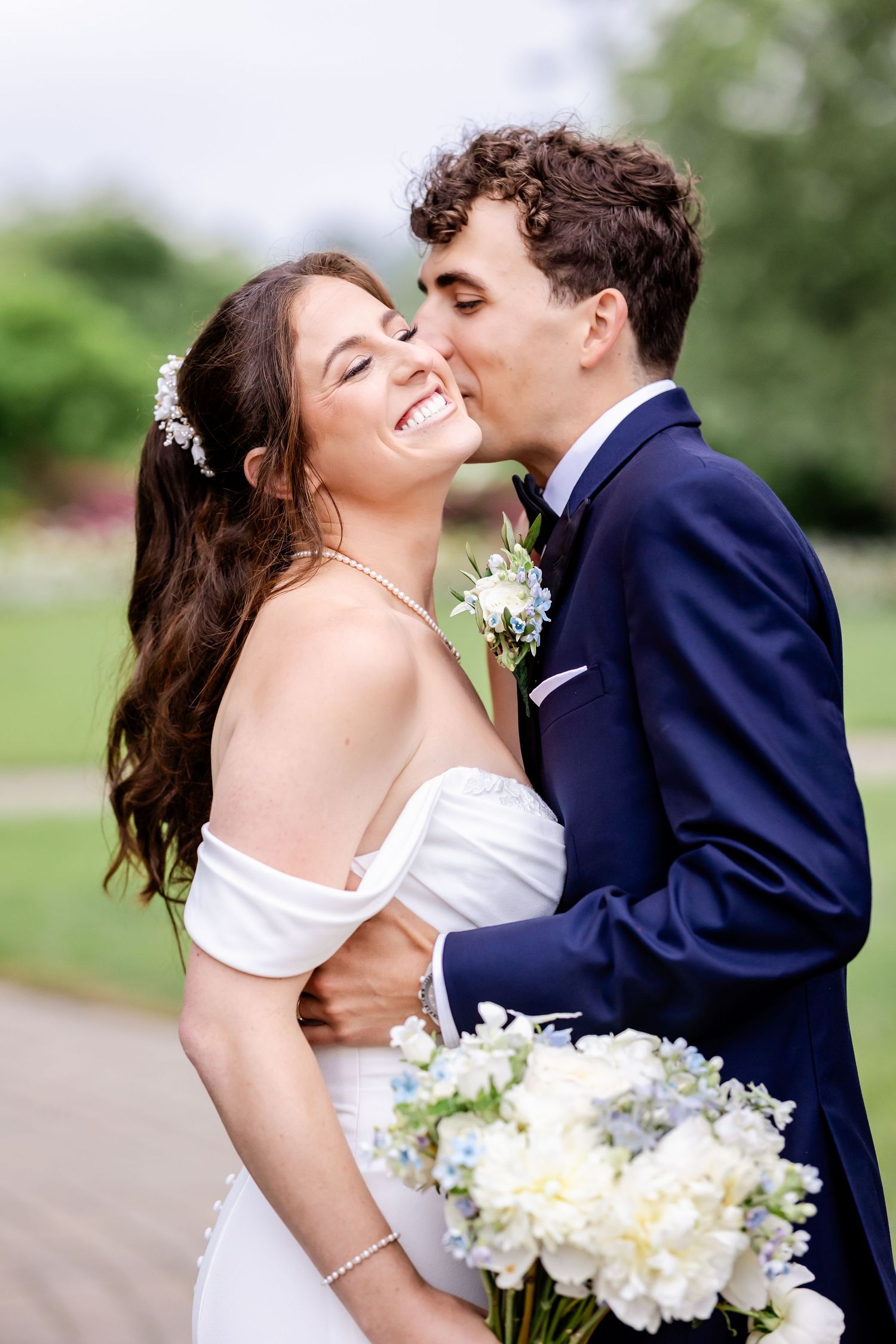 A romantic wedding photoshoot sequence showing tender moments between newlyweds with white floral bouquet.