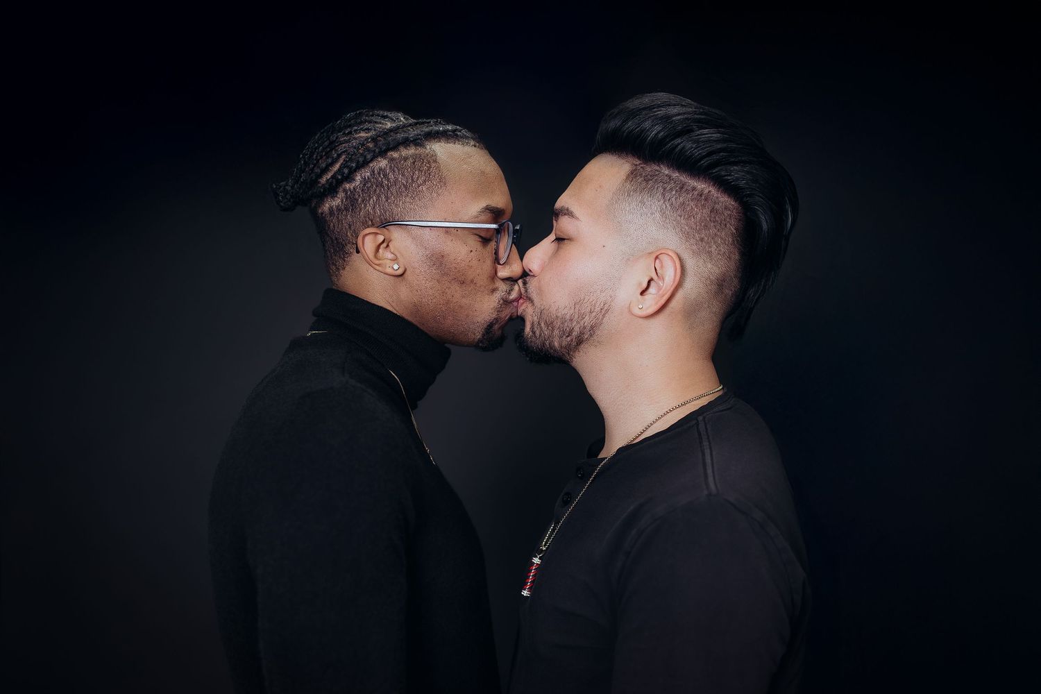 Intimate black and white portrait series showing two people in close proximity against dark background.