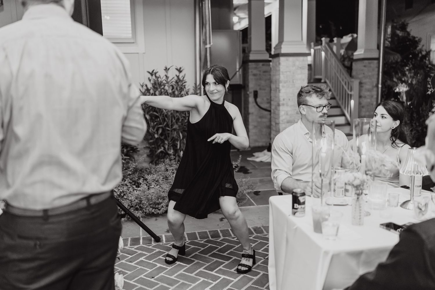 Black and white photo montage showing people dining and socializing at an elegant restaurant setting.