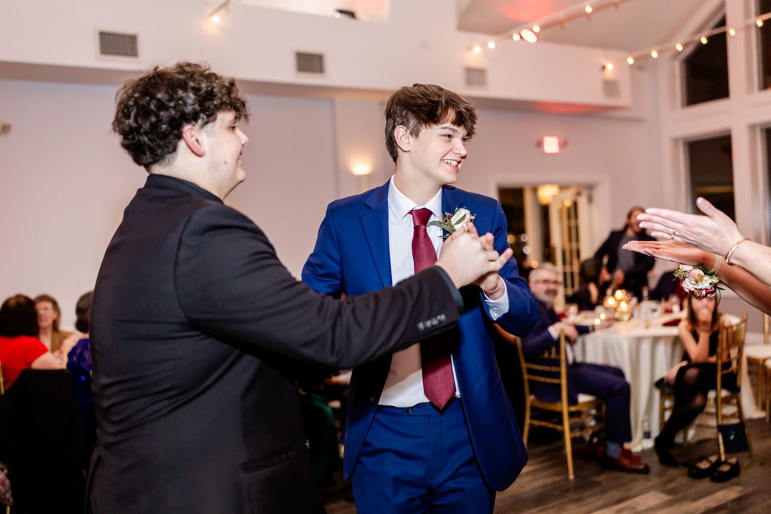 Wedding reception dance floor filled with guests enjoying the celebration.