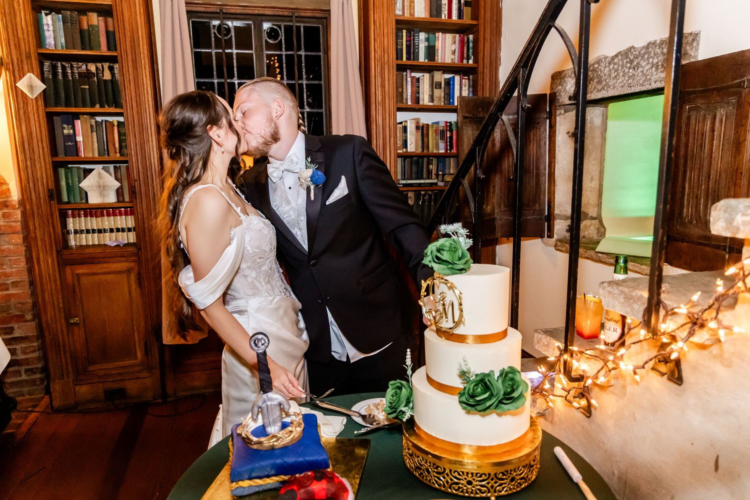 A series of wedding reception photos showing cake cutting and dancing in an elegant wood-paneled library setting.