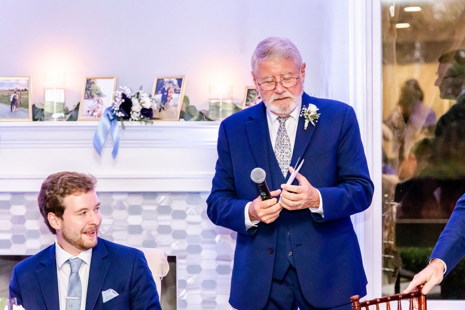 Wedding reception guests enjoying entertainment and dancing in an elegant indoor venue.