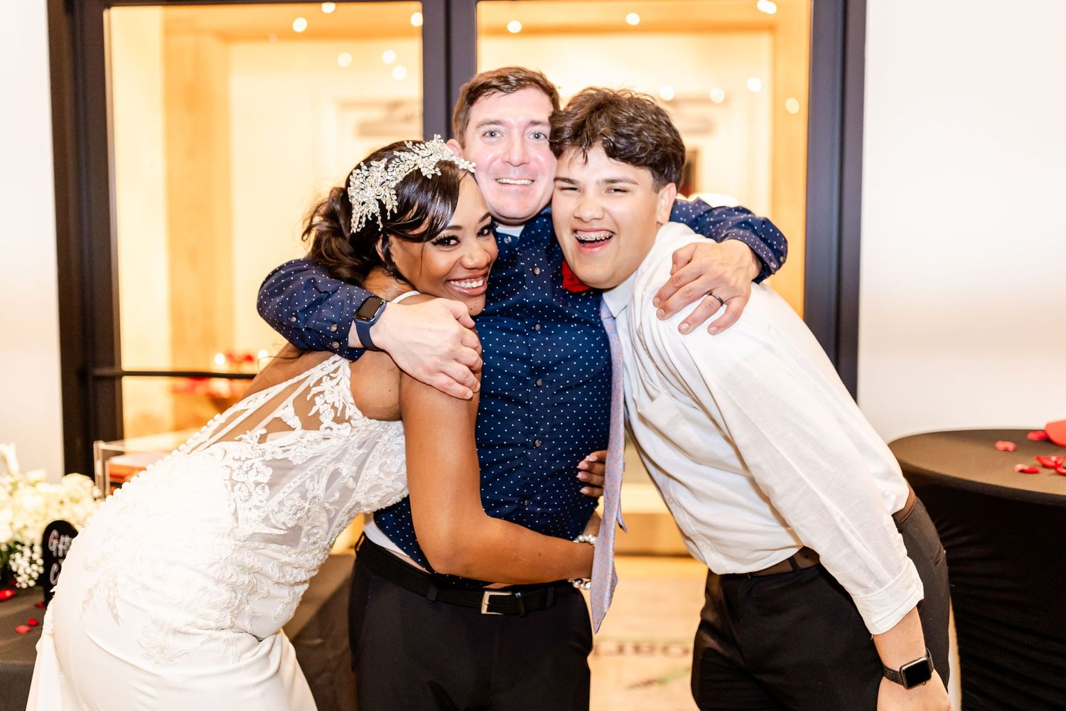 Joyful celebratory moment captured at a wedding reception indoors.
