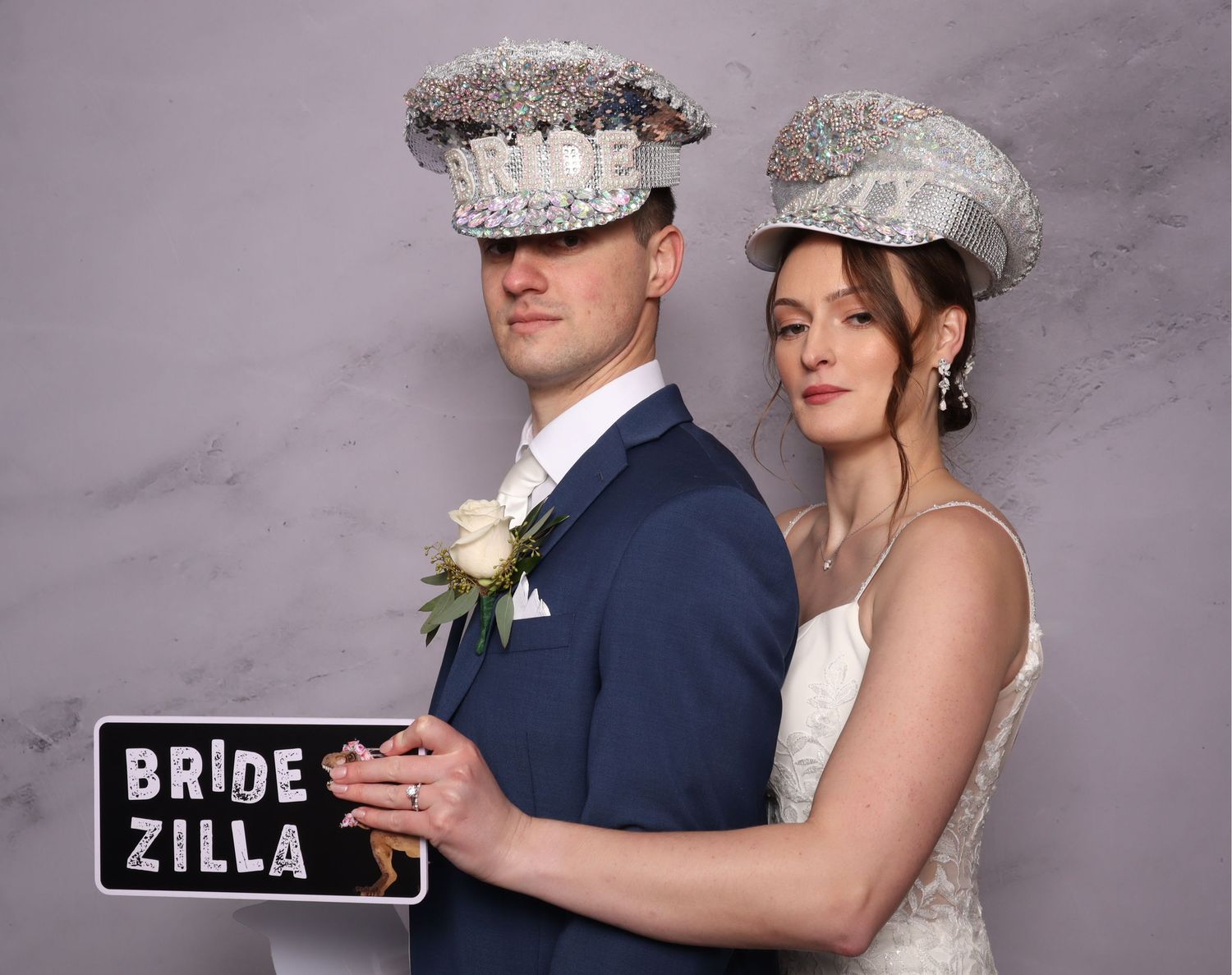 Wedding photo booth series showing couple posing with fun props and signs.