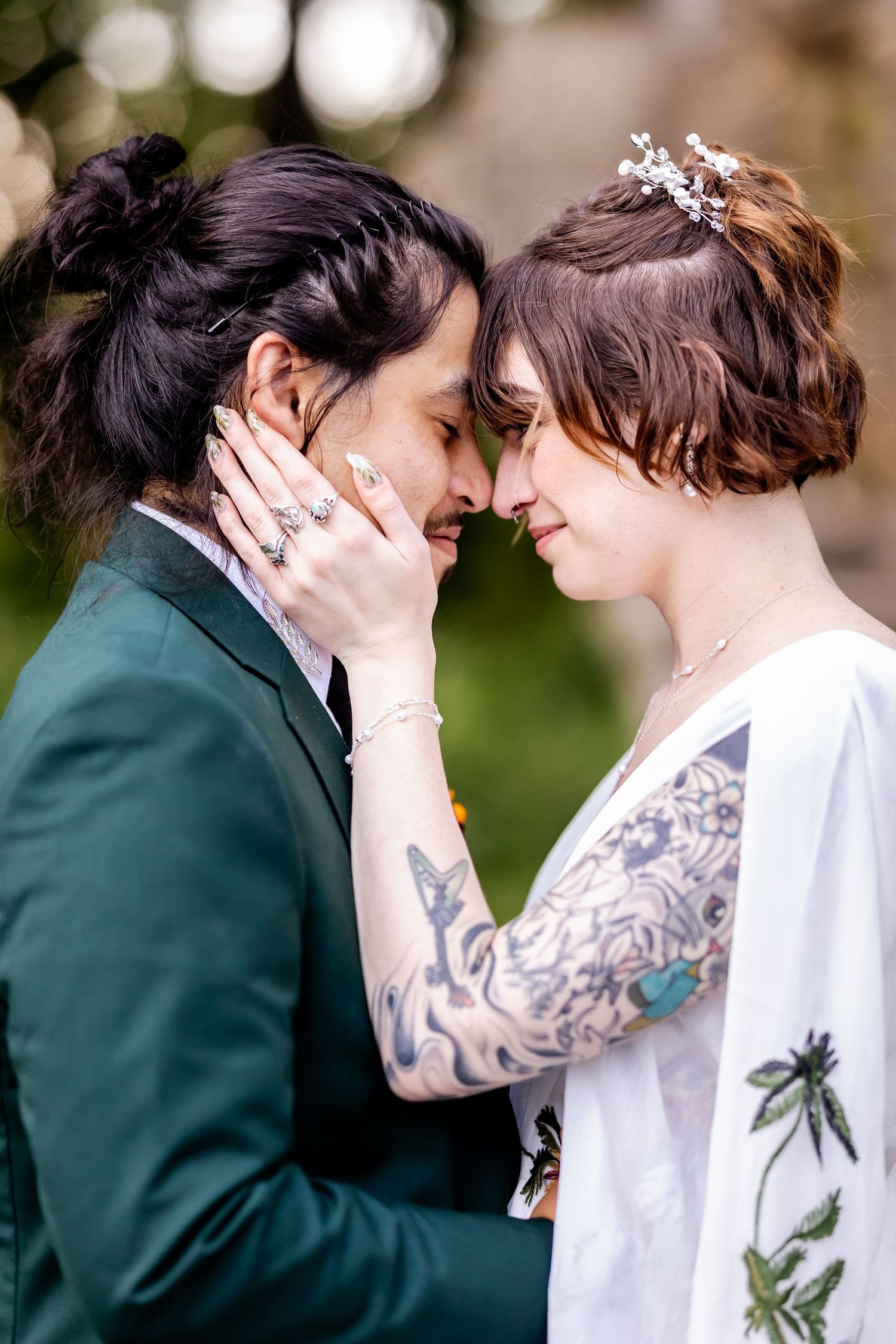 A romantic series of wedding photos showing a couple in tender moments with visible tattoo art and formal attire.