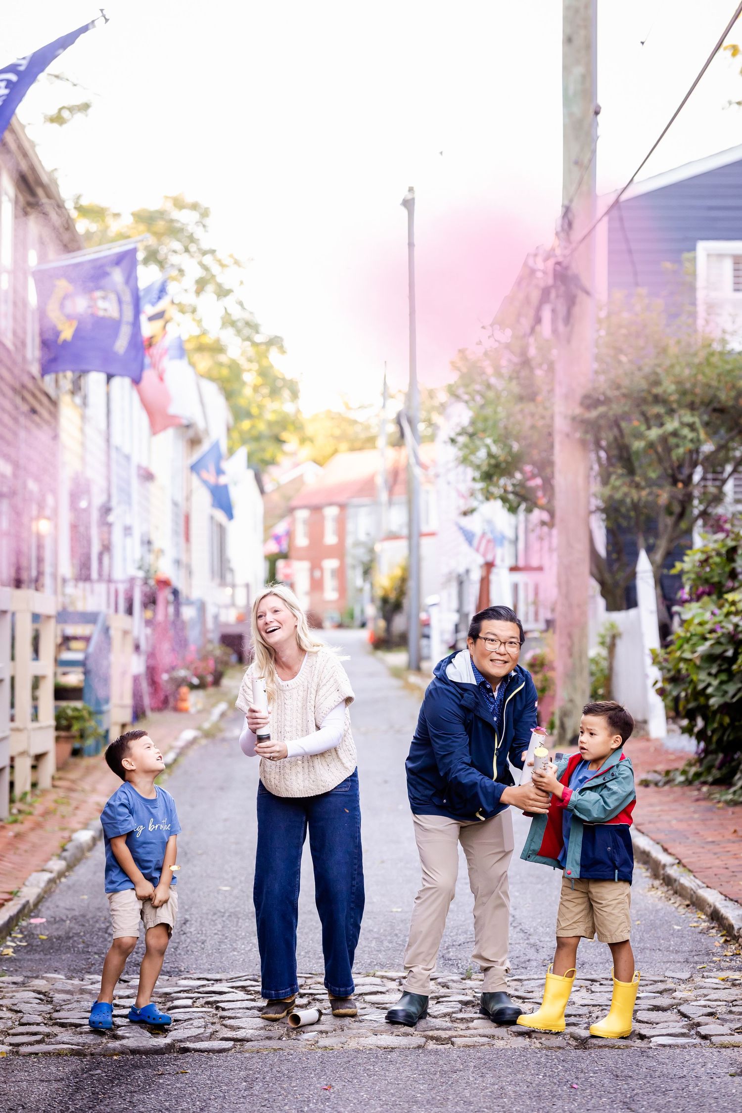 A series of candid photos showing a parent and child walking together on a cobblestone street.