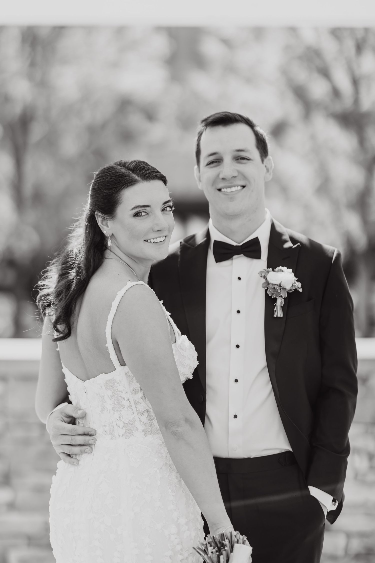 Black and white series of romantic formal portraits showing a couple on their wedding day.