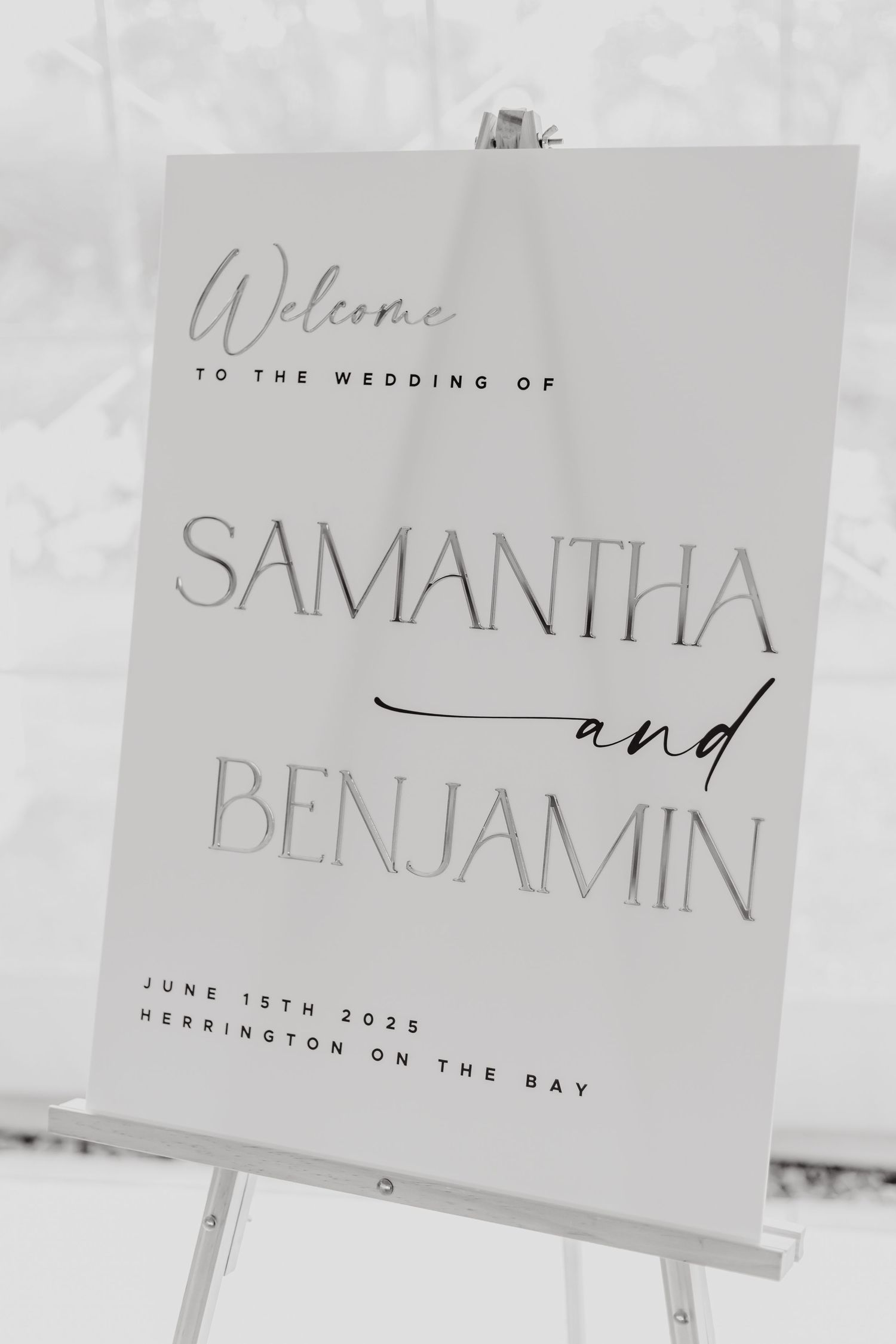 Elegant wedding welcome sign displays names Samantha and Benjamin in modern typography on white background.