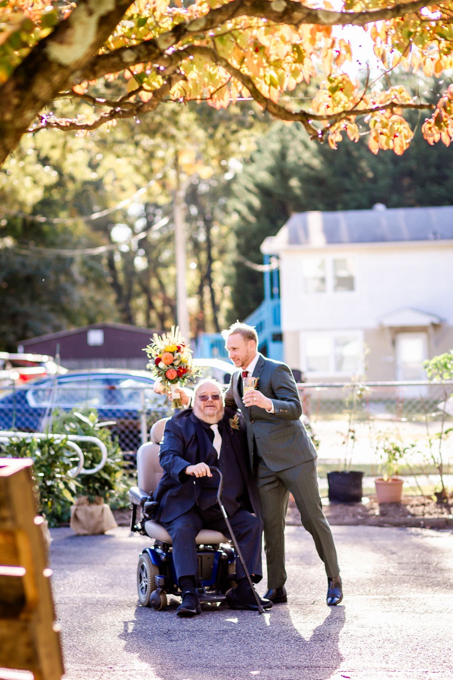 Autumn wedding photoshoot under golden leaves with creative poses in outdoor setting.