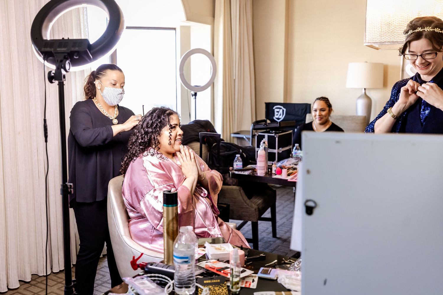 Behind the scenes of wedding preparation with professional lighting and styling equipment.