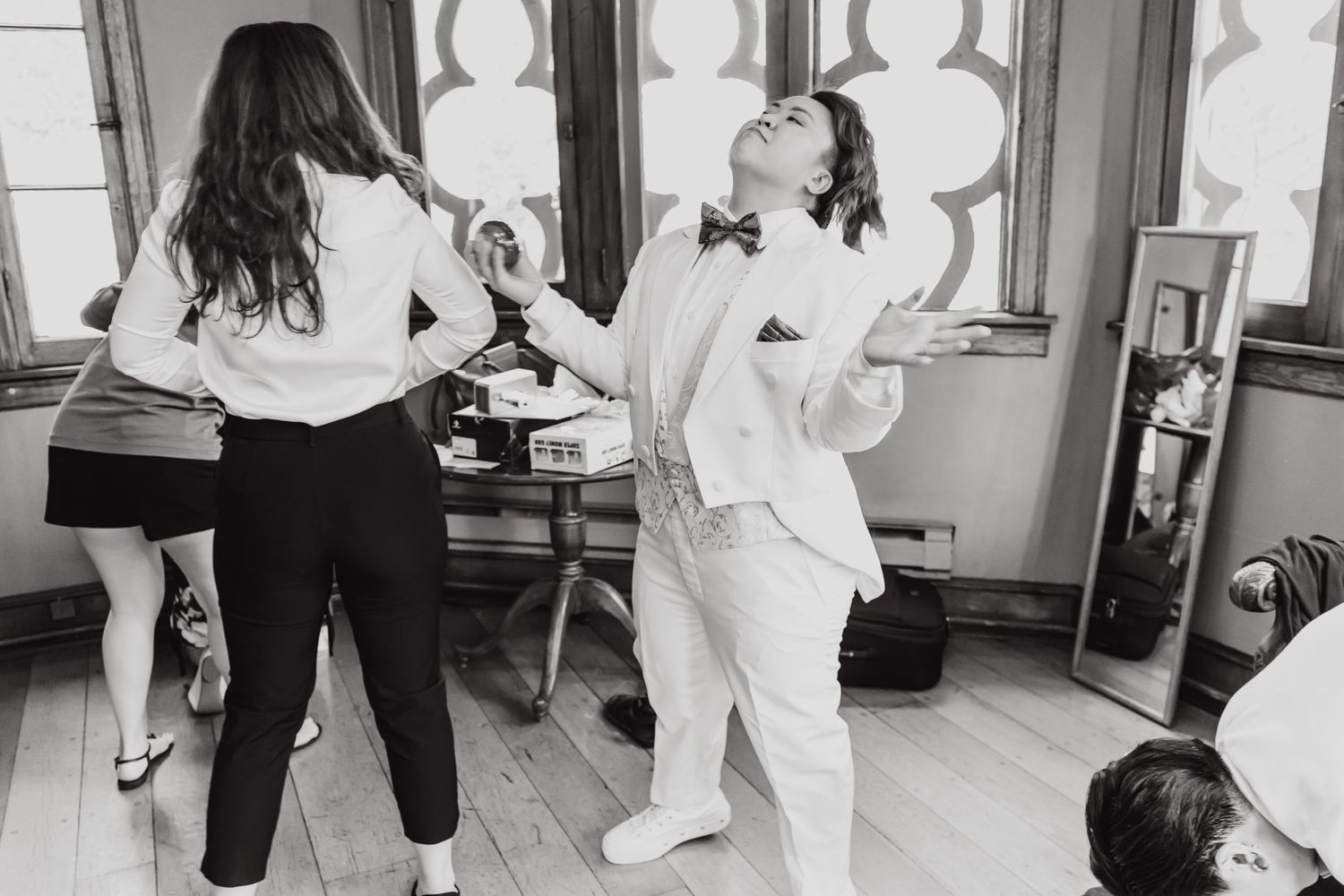 A group dances together in a bright room during celebrations.