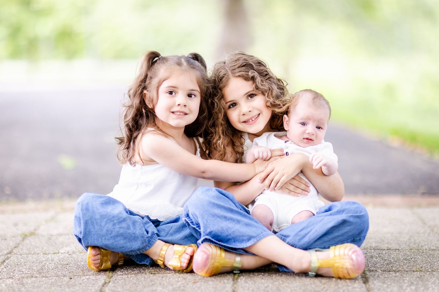 Casual outdoor portrait session with soft natural lighting and paved background.