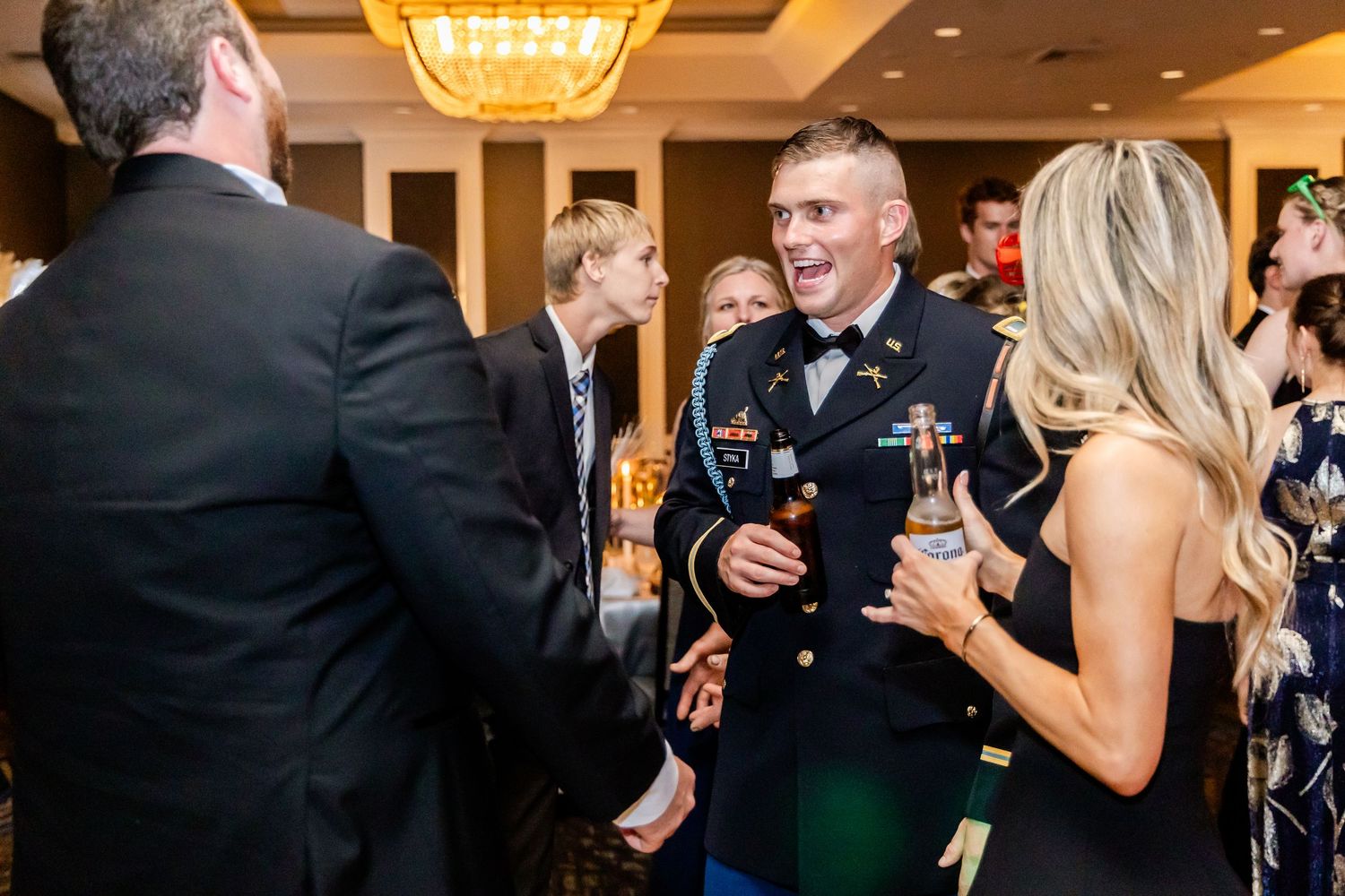Guests socializing and mingling at an elegant evening reception.