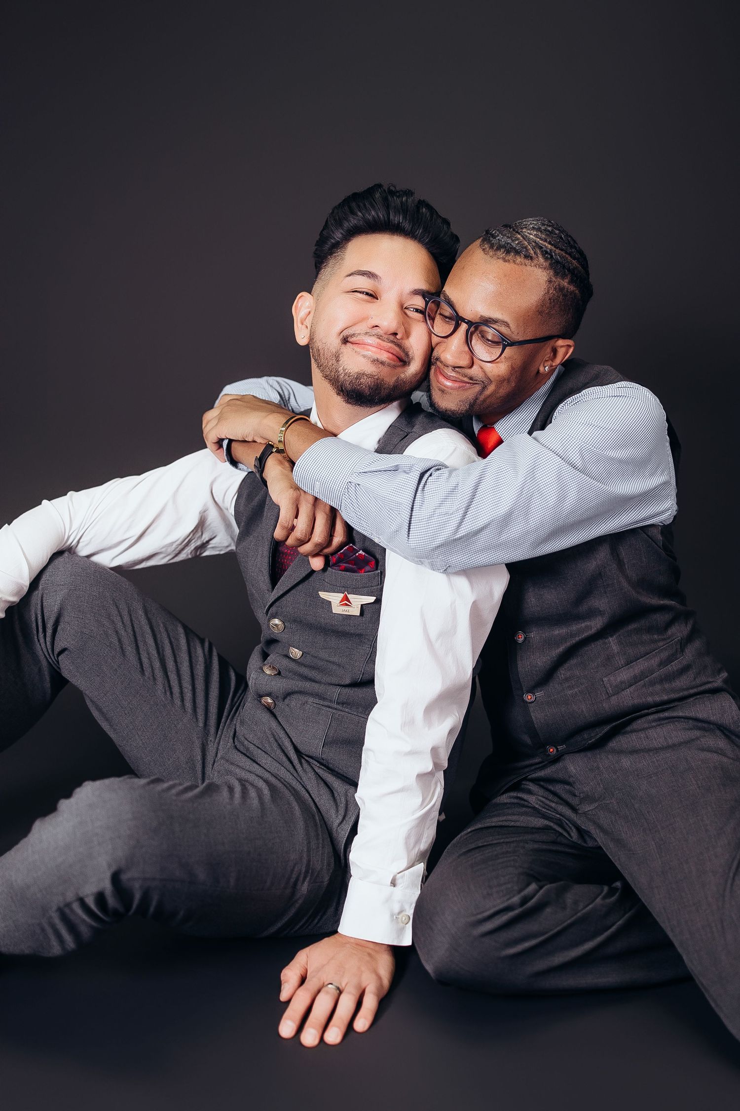 Two people in formal attire share intimate moments in a series of black and white studio photographs.