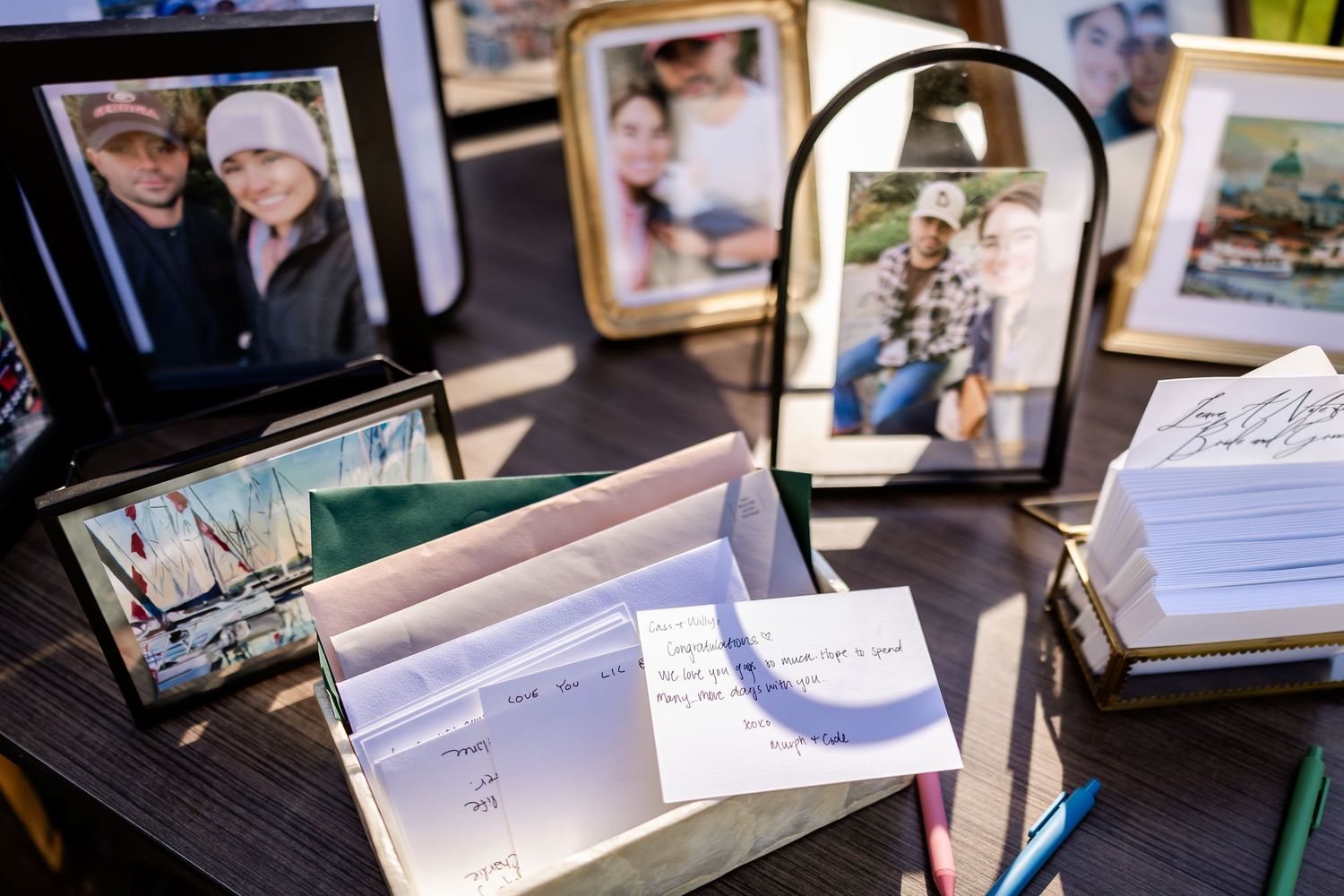 Collection of photo albums and memory books displayed on a dark surface.