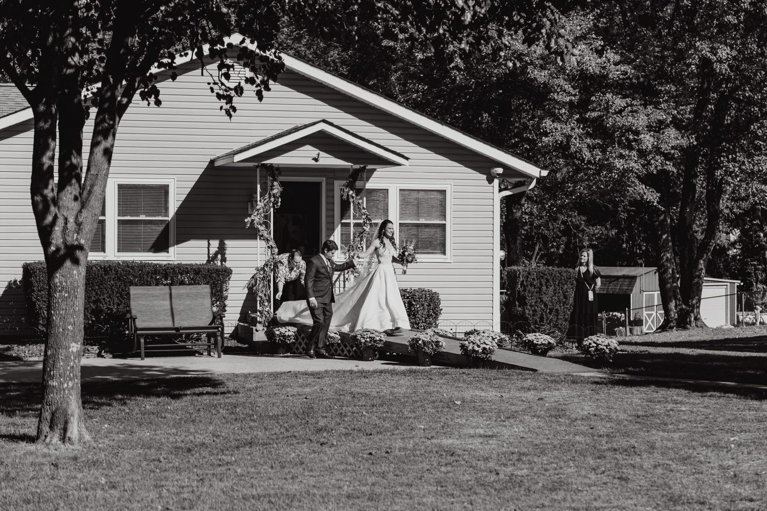 Black and white photograph of a classic ranch-style house exterior.