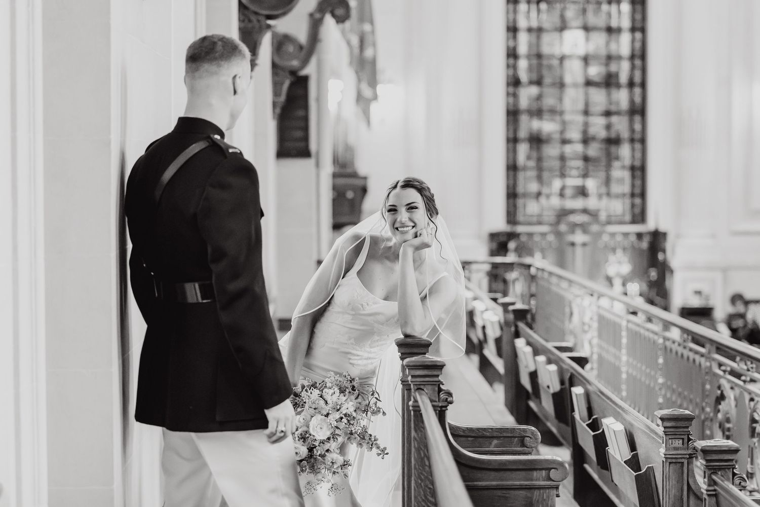 A black and white wedding photo collage showing candid moments of a celebration with dancing and embraces.