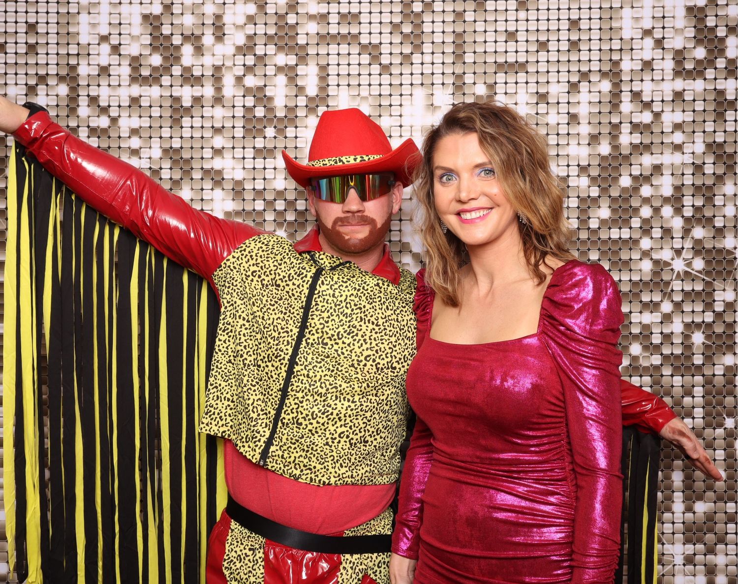 Photo booth shots with metallic backdrop and colorful party outfits.