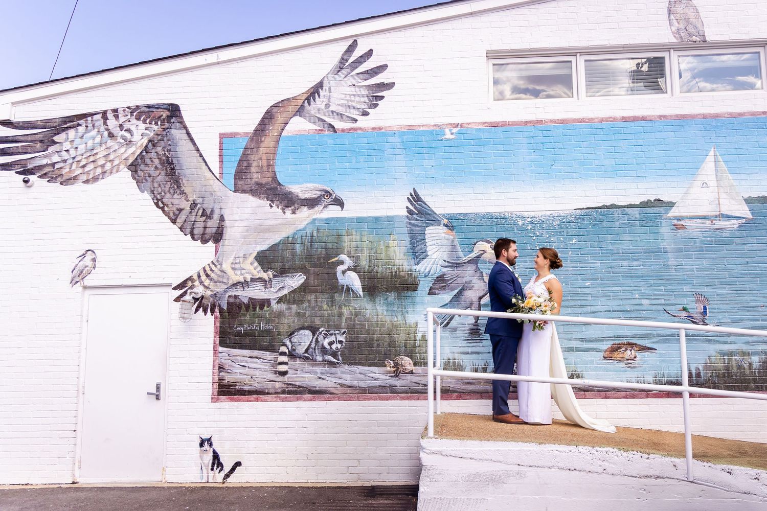 A series of beach wedding photos with seagulls flying across coastal scenes with boats and blue water in the background.