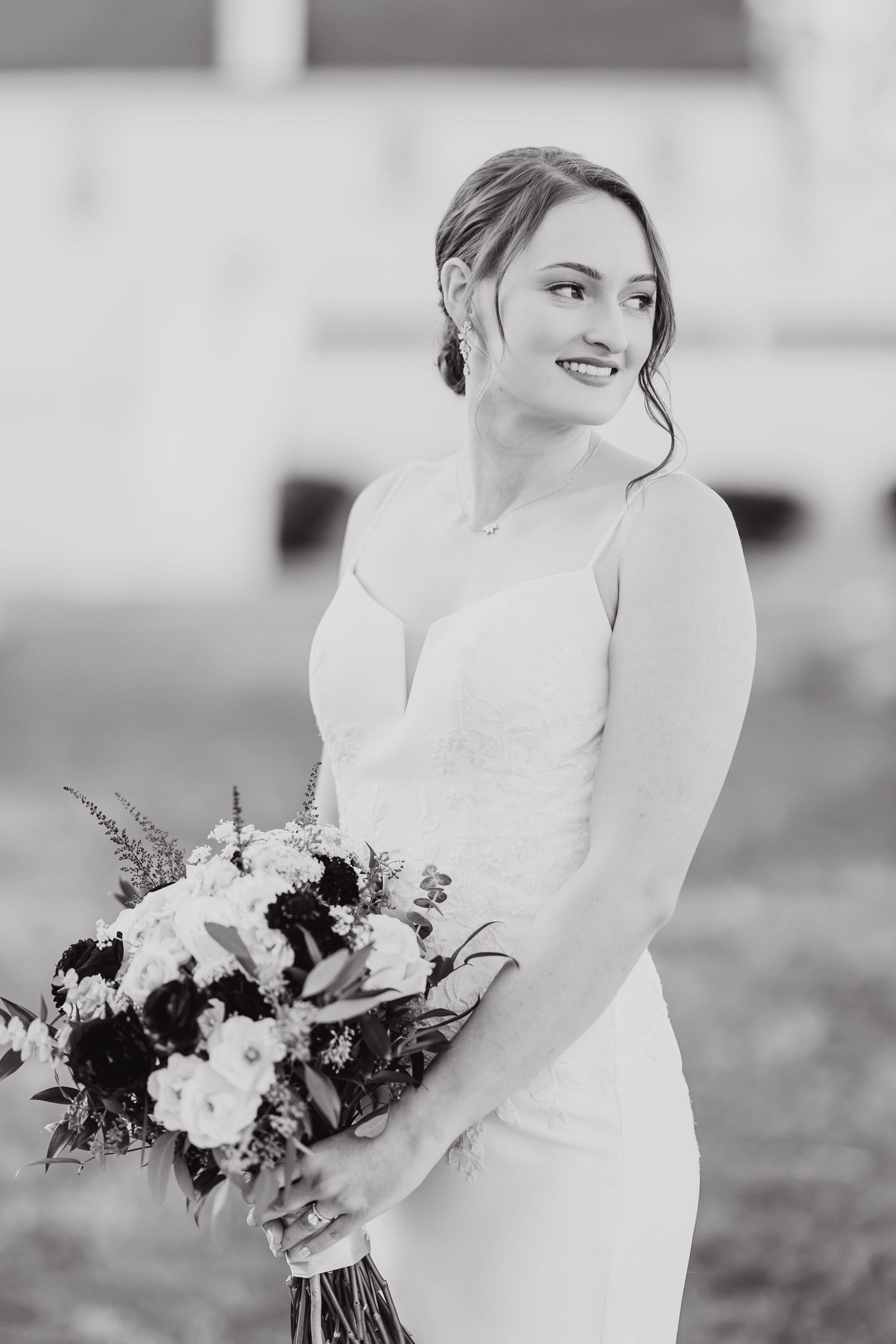 Close up portrait shots of a bride in a white wedding dress holding a beautiful floral bouquet.