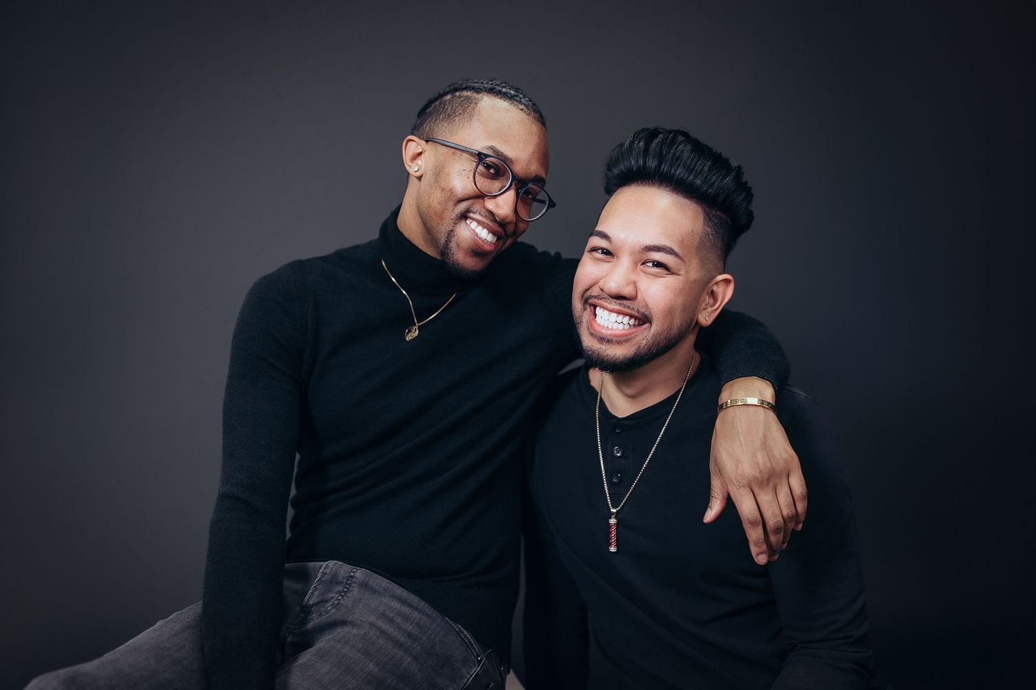 Two friends share joyful moments in a series of casual poses against a dark studio background.